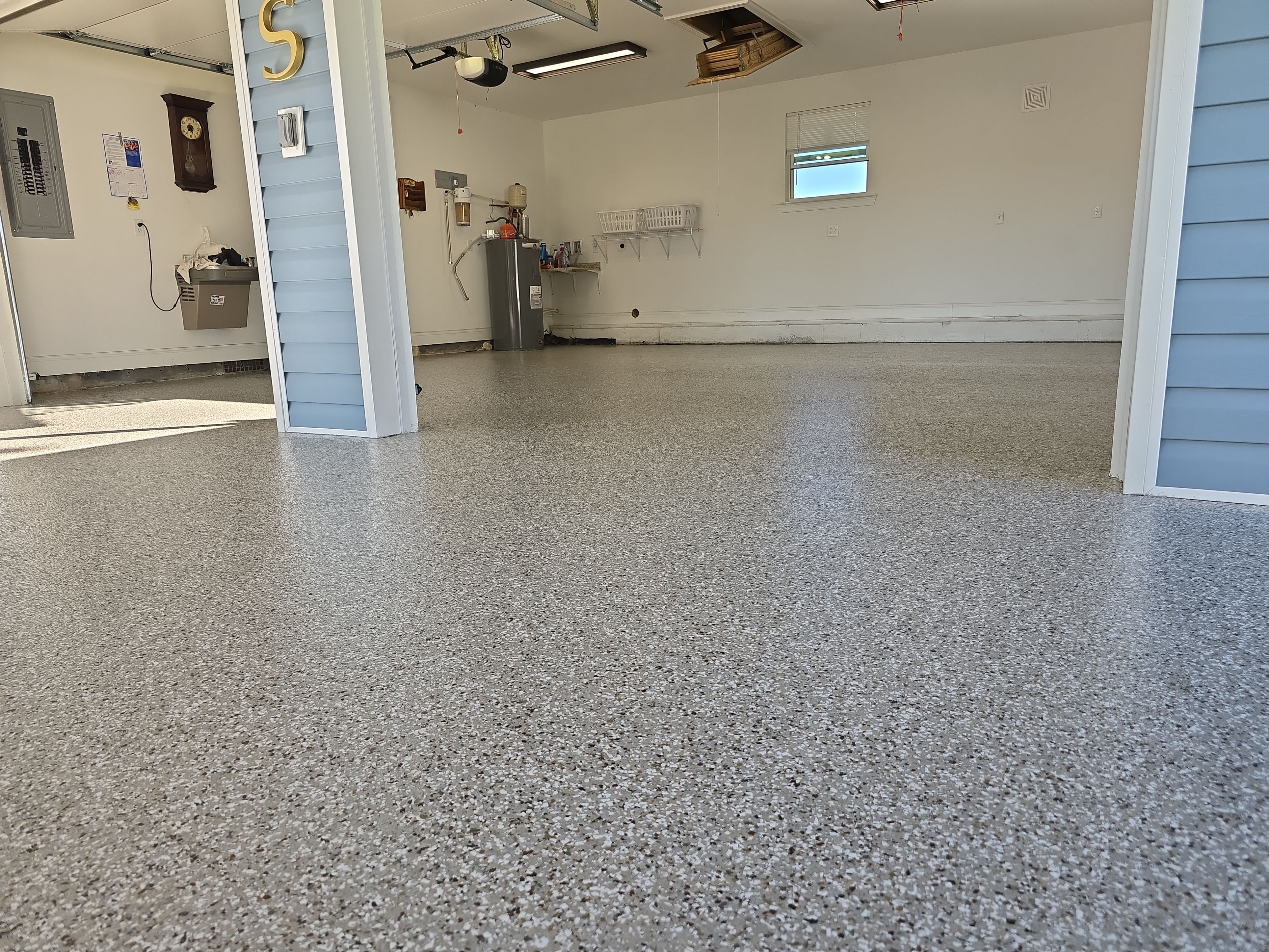 Garage & Patio Transformation Using Creekbed by Elite Floor Solutions