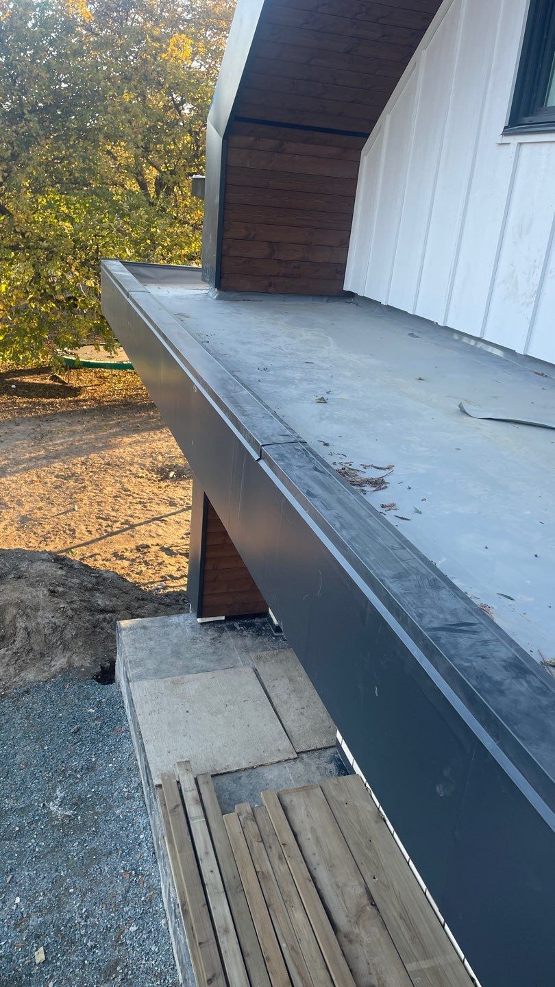 Residential Roofing Installation using multiple products by Top Notch Roofing Inc