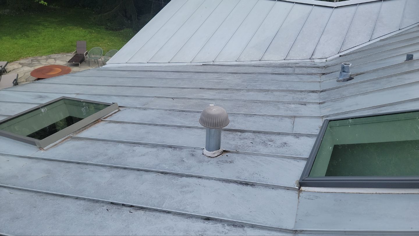 roof washing using Algaecide, soft wash soap by Northern Power Washing LLC.