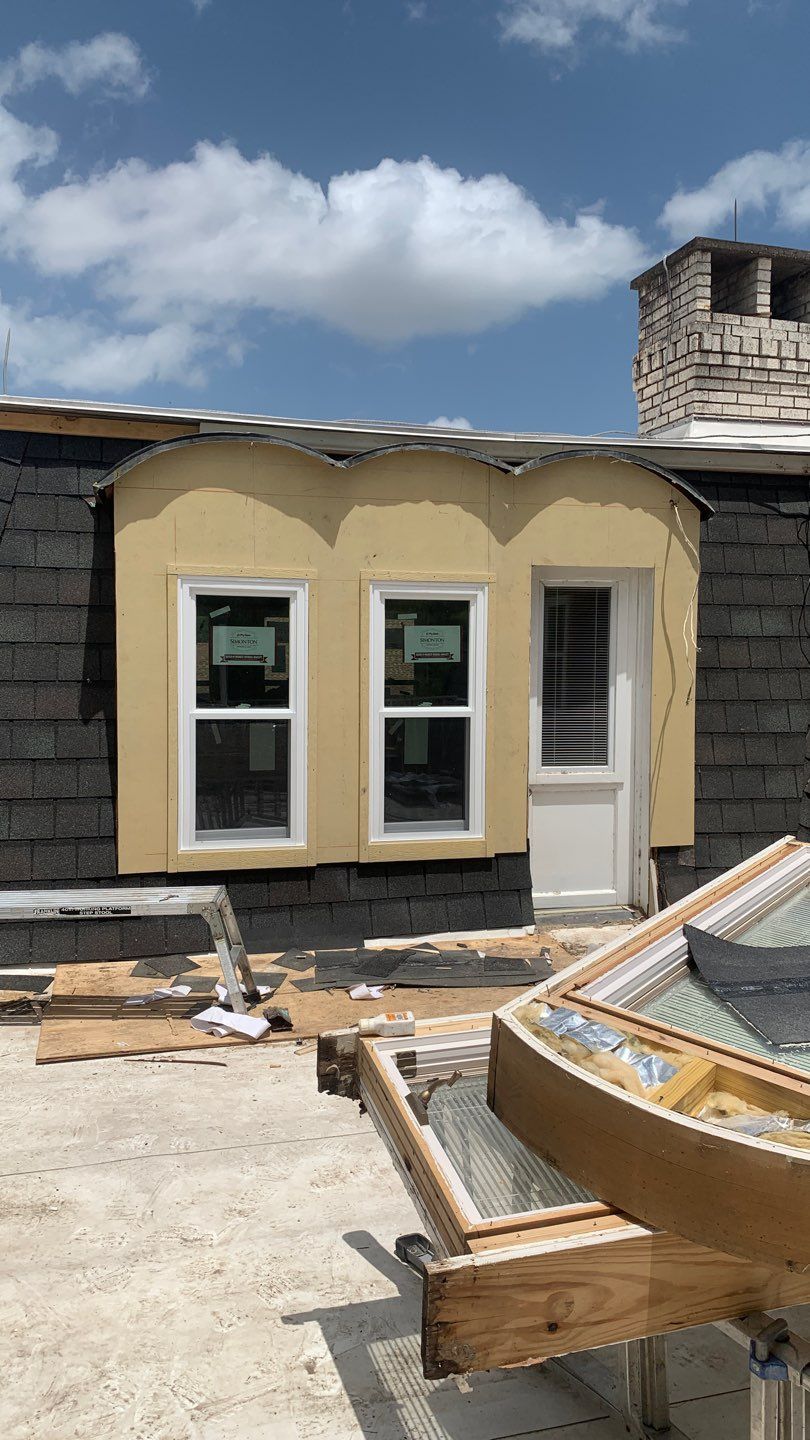 Mansard Charm by Bayfront Roofing and Construction