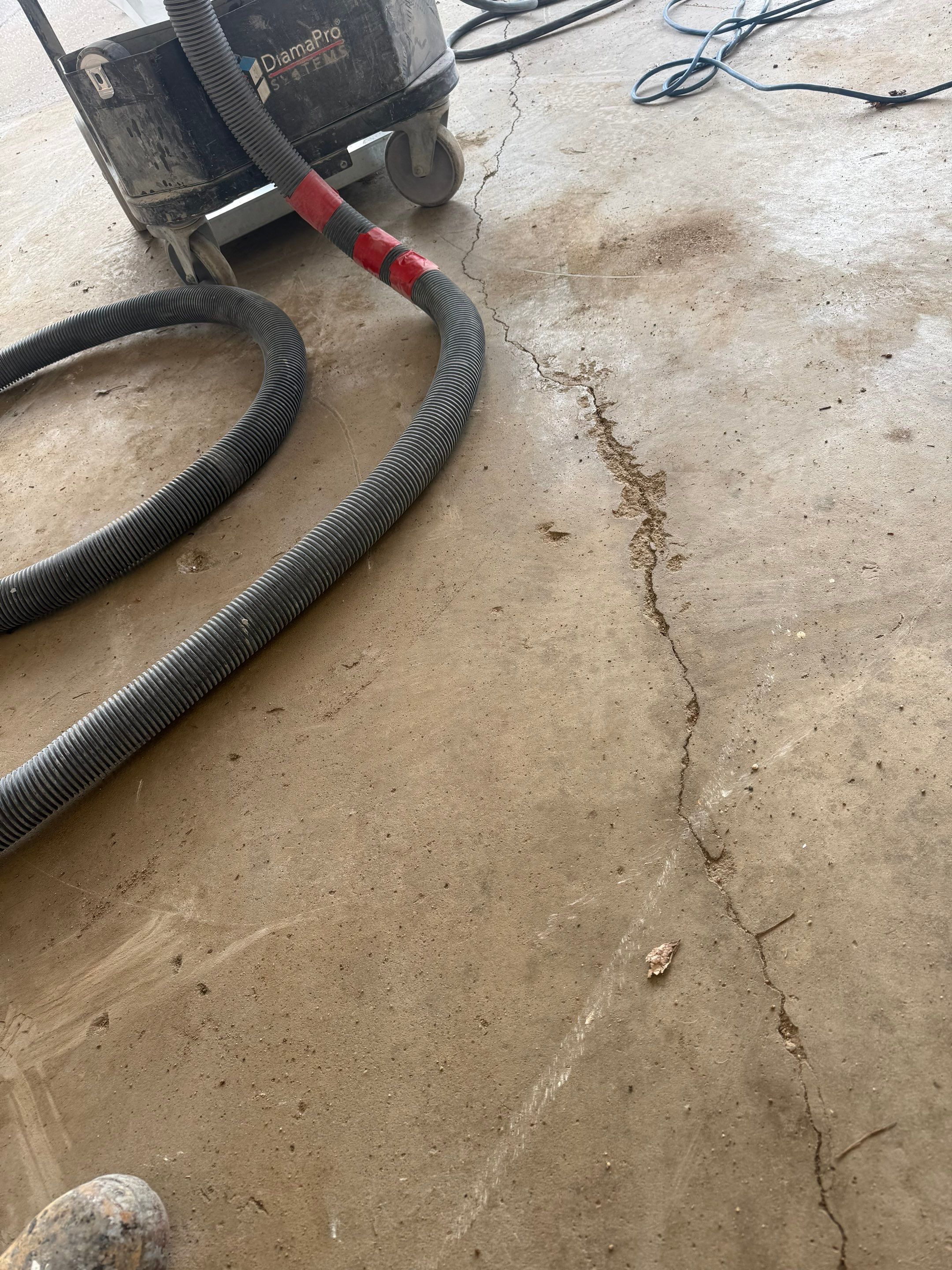 Feather Grey Garage Floor Coating and Crack Repair in Beresford by Select Painting, Coatings & Garage Cabinets
