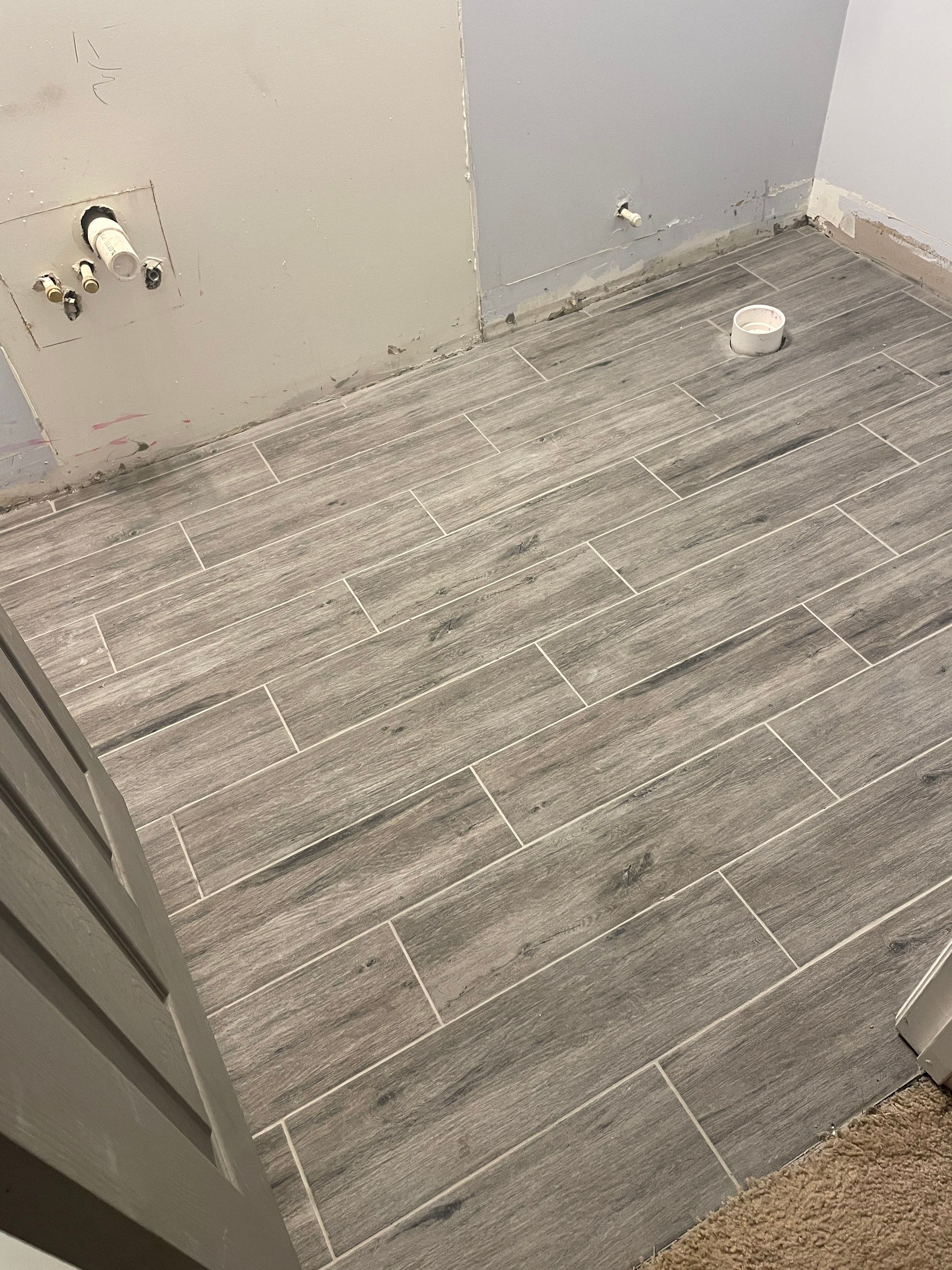 Sleek bathroom shower remodel by Footprints Floors of East Atlanta