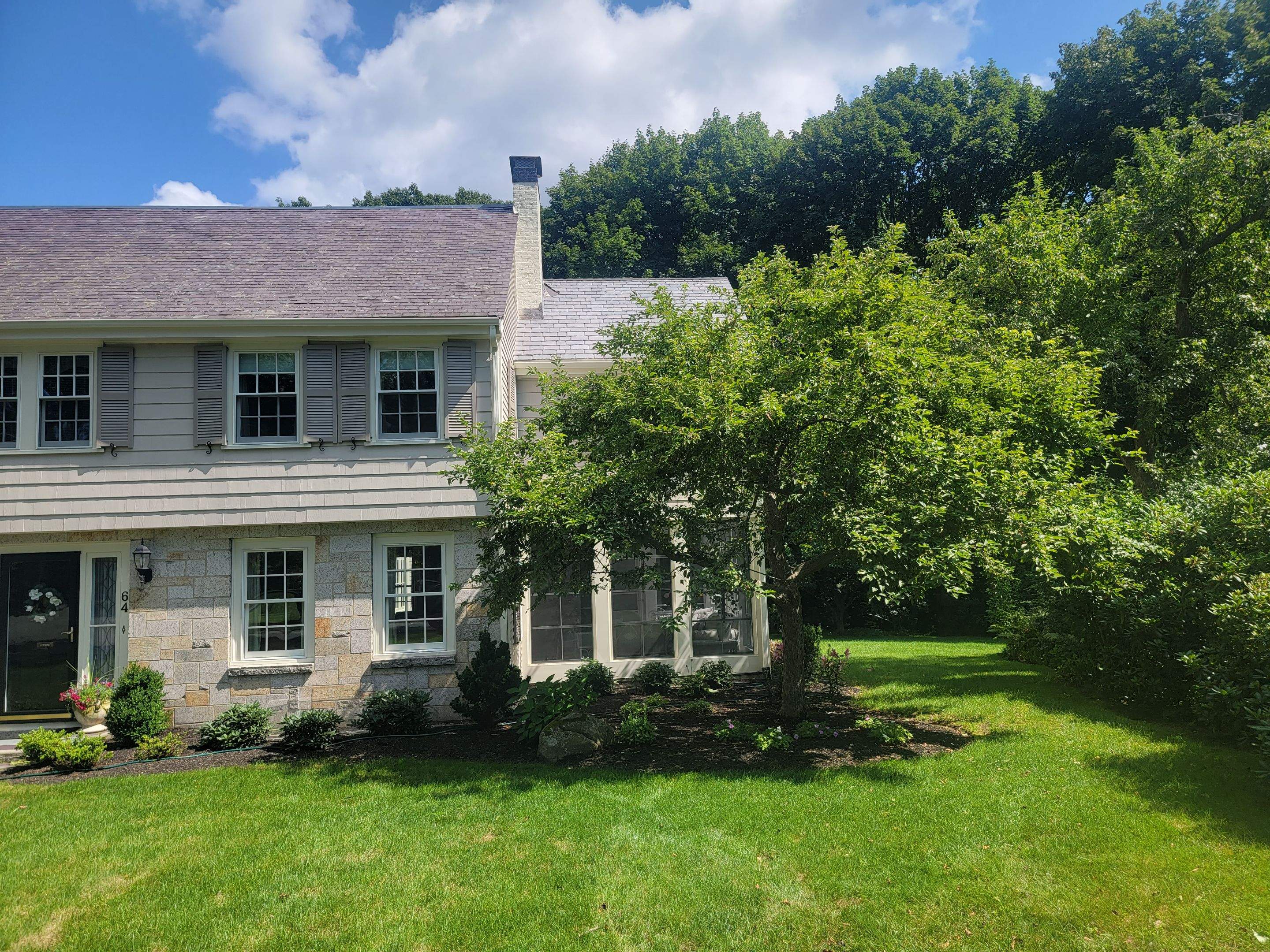 Wood Clapboards and vinyl Slate roof with new Pella windows in Wellesley. by UBrothers Construction