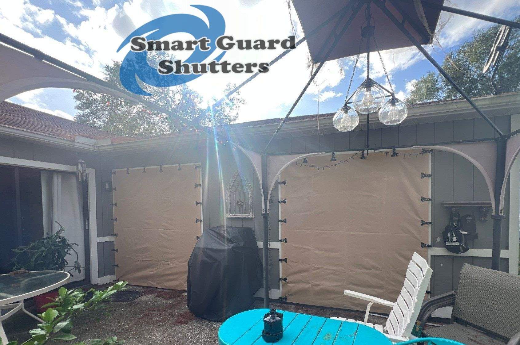 AstroGuard Hurricane Fabric in Tan & Impact Bahamas in Water Blue by Smart Guard Shutters