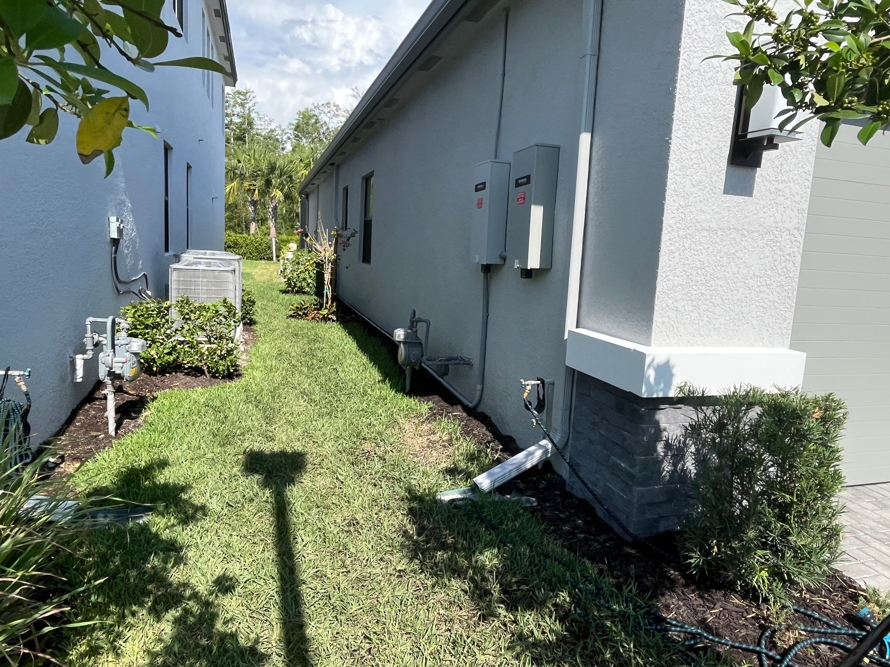 Grey Seamless Gutter Installation in Estero FL by Gutter Professors