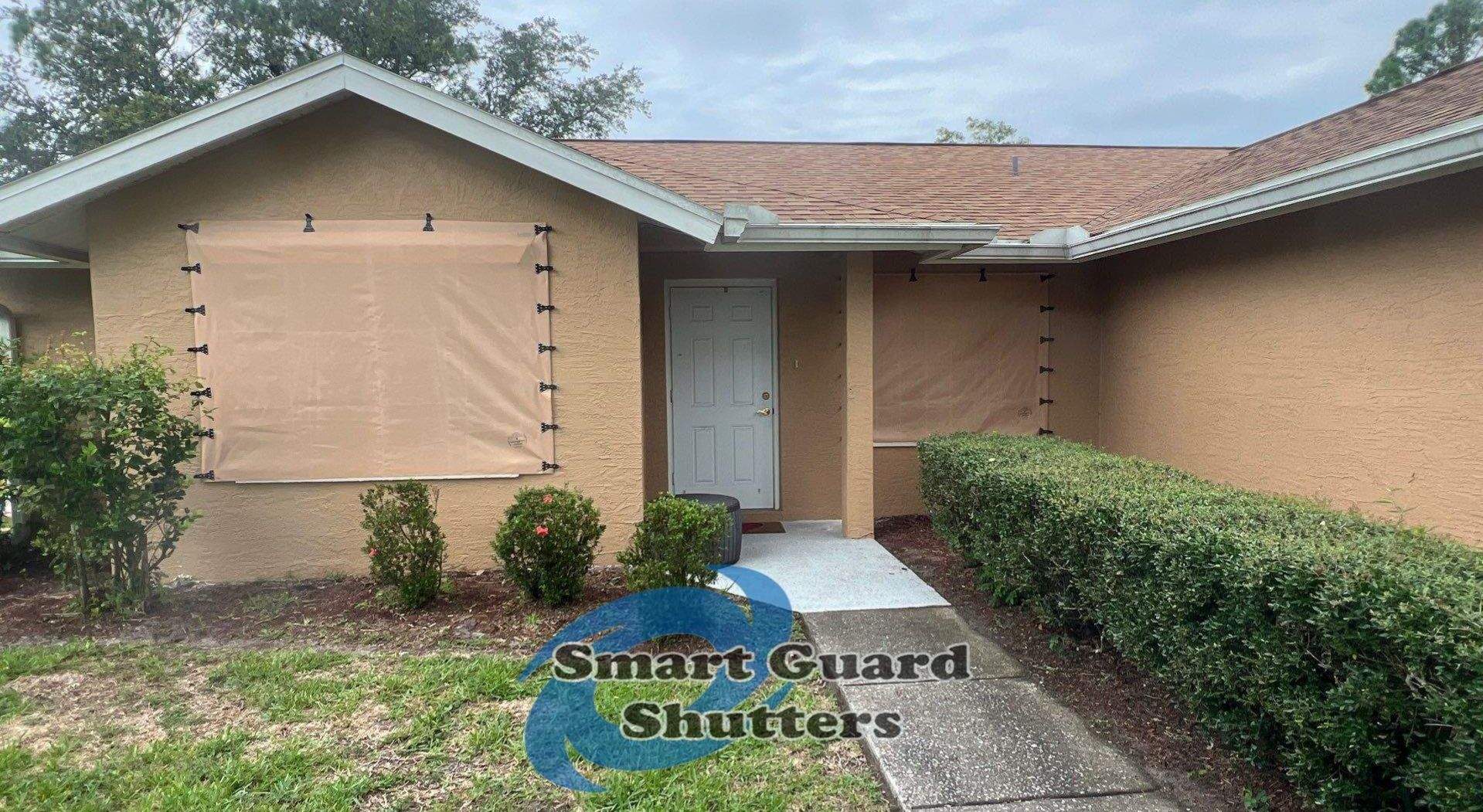 AstroGuard Hurricane Fabric in Tan by Smart Guard Shutters