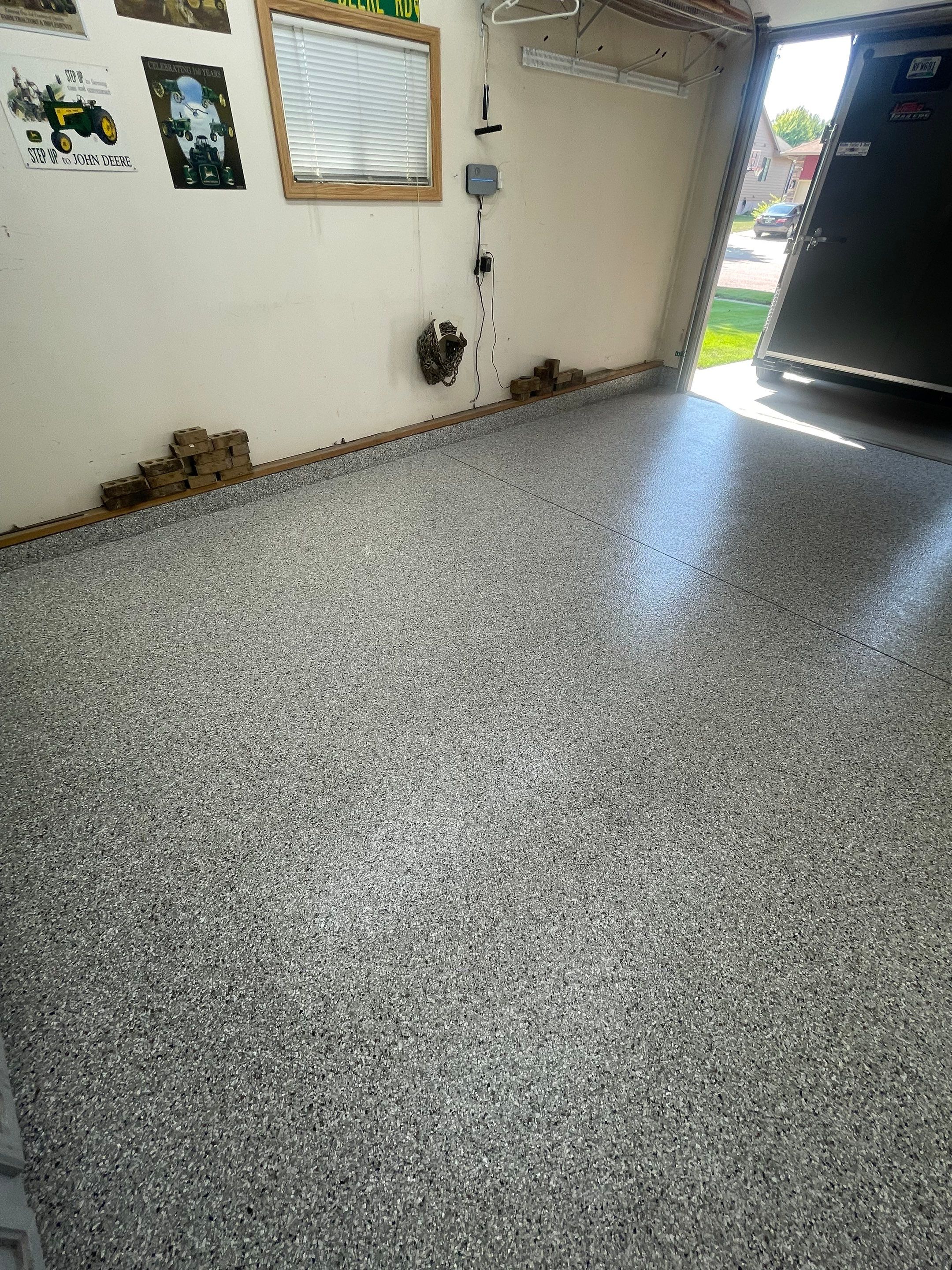 Multi-Stall Garage Floor Coating Installation in Sioux Falls by Select Painting, Coatings & Garage Cabinets