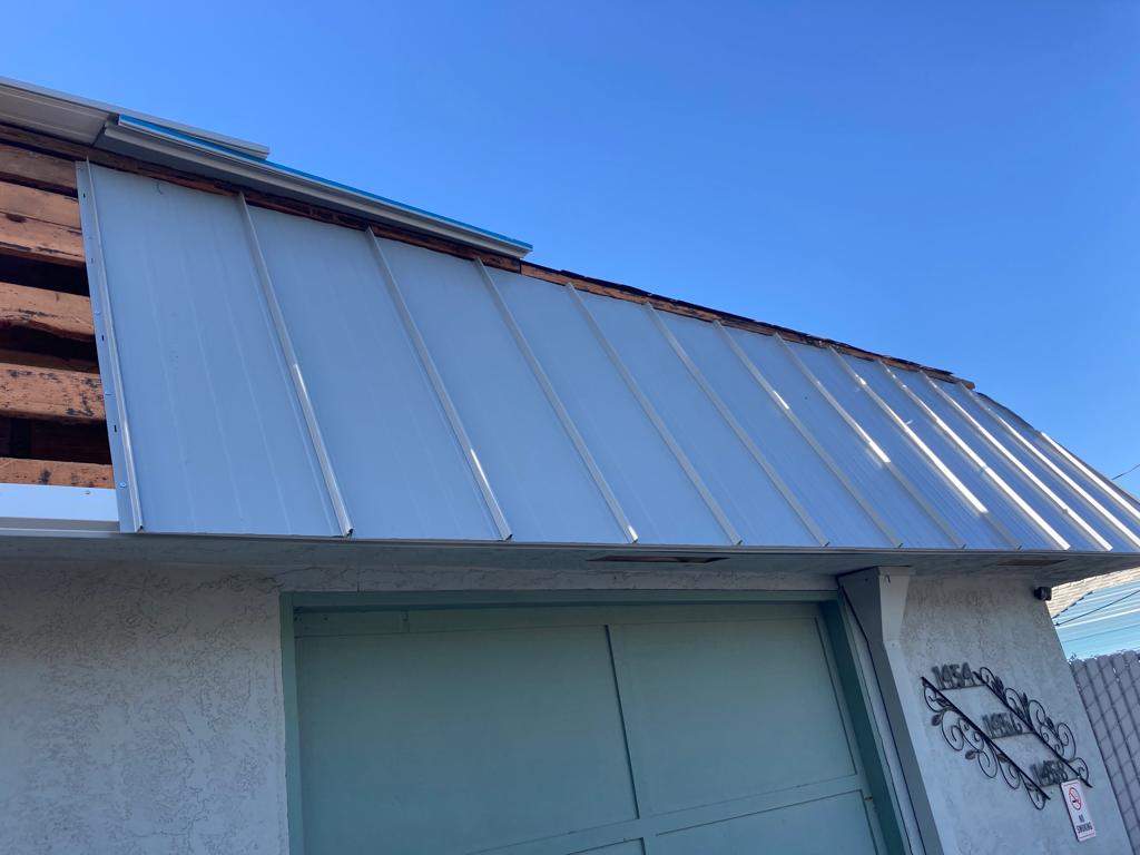 Foam Refurbish using Conklin Benchmark/PUMA XL coatings and spray foam; Also metal roofing around parapet wall by Straight Edge Roofing Inc