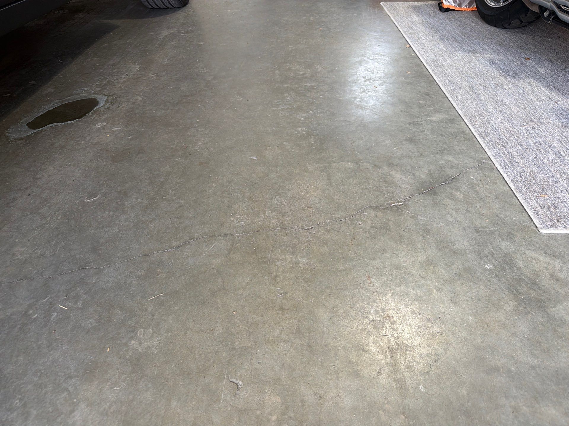 Residential Garage Floor Coating with Feather Grey Finish in Sioux Falls by Select Painting, Coatings & Garage Cabinets