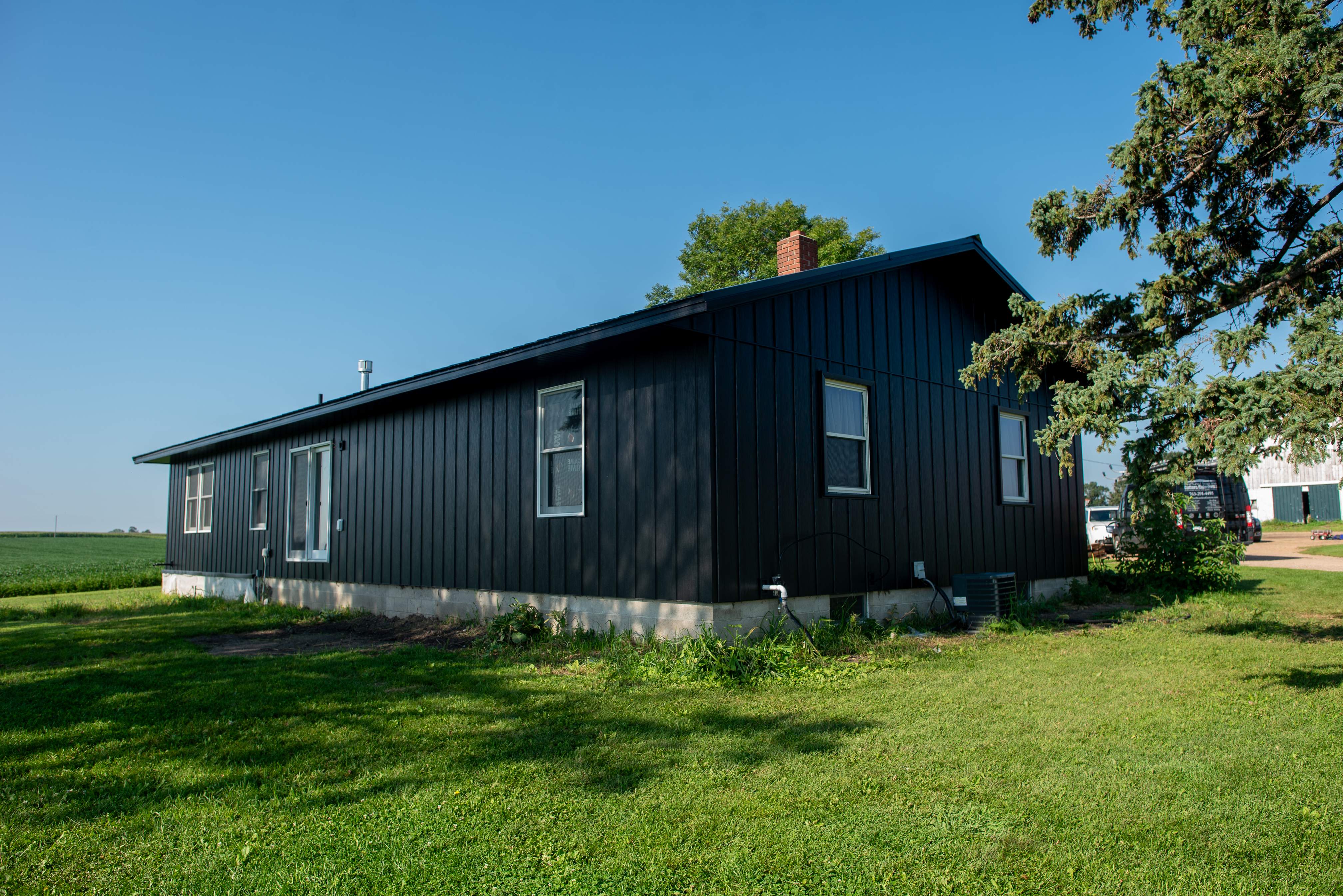 EDCO Steel Siding with Black Fascia & Soffit – Waverly, MN by Next Level Seamless Gutters / Exteriors Inc.
