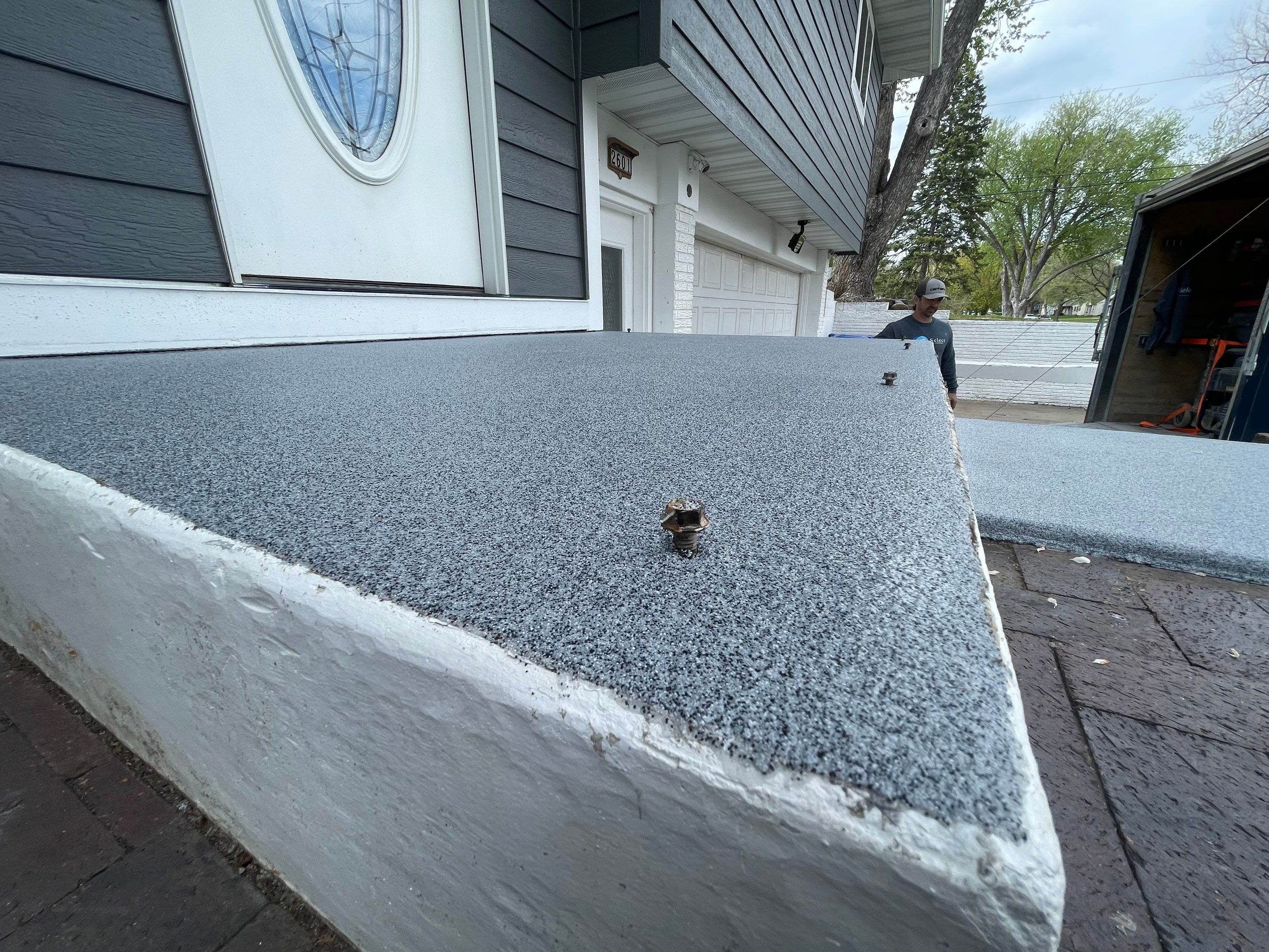 Grey Polyaspartic Porch and Stair Resurfacing in Sioux Falls by Select Painting, Coatings & Garage Cabinets