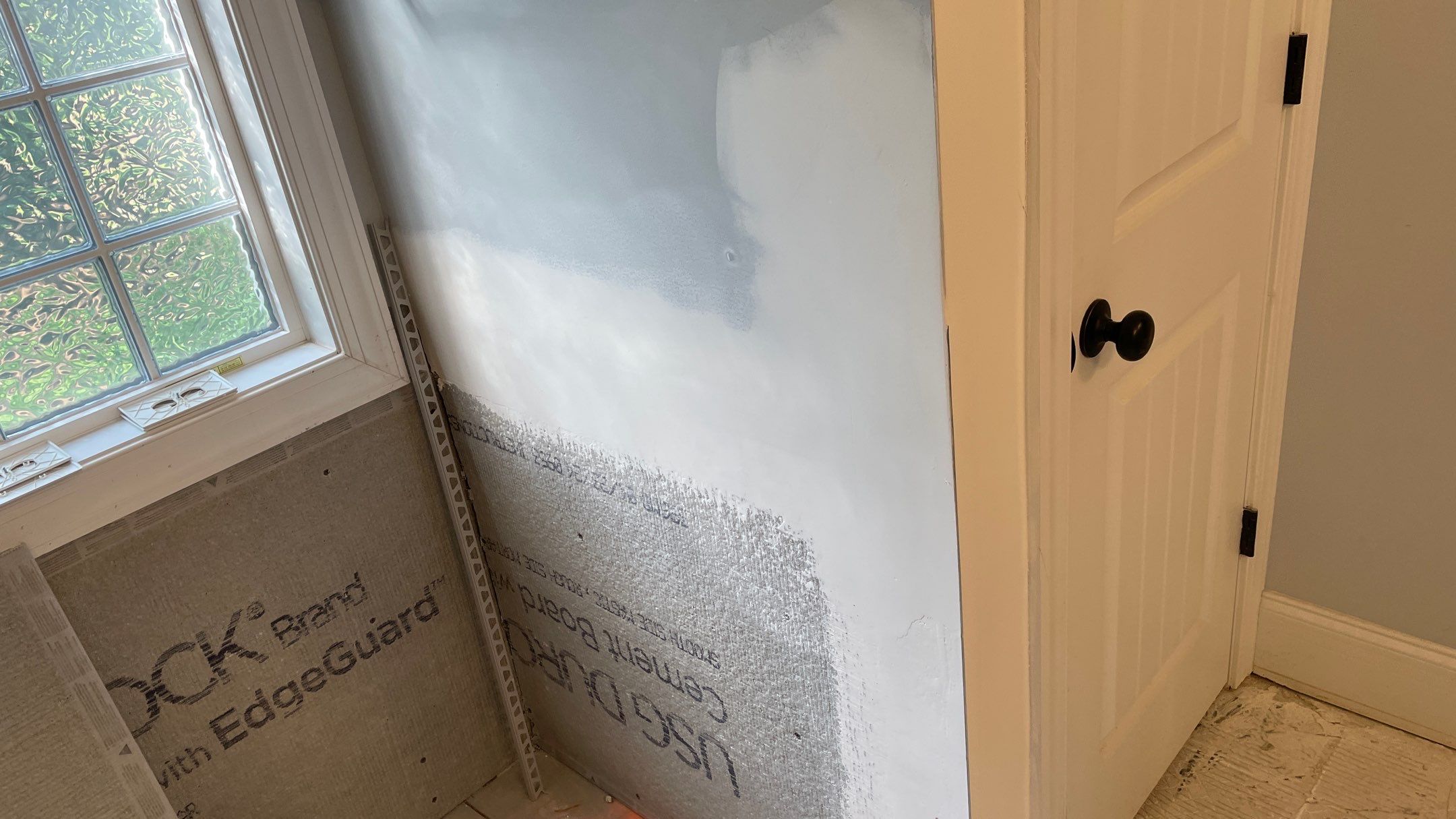 Bright Bathroom Remodel with Wall Removal, Stand Alone Tub and New Vanity by Footprints Floors of Coastal Carolina