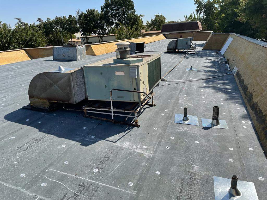 Commercial Roofing Installation using General Coatings acrylic coatings and spray foam by Straight Edge Roofing Inc
