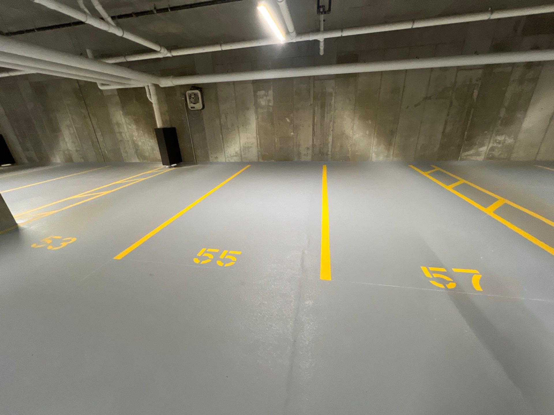 Parking garage using Hot water by Northern Power Washing LLC.