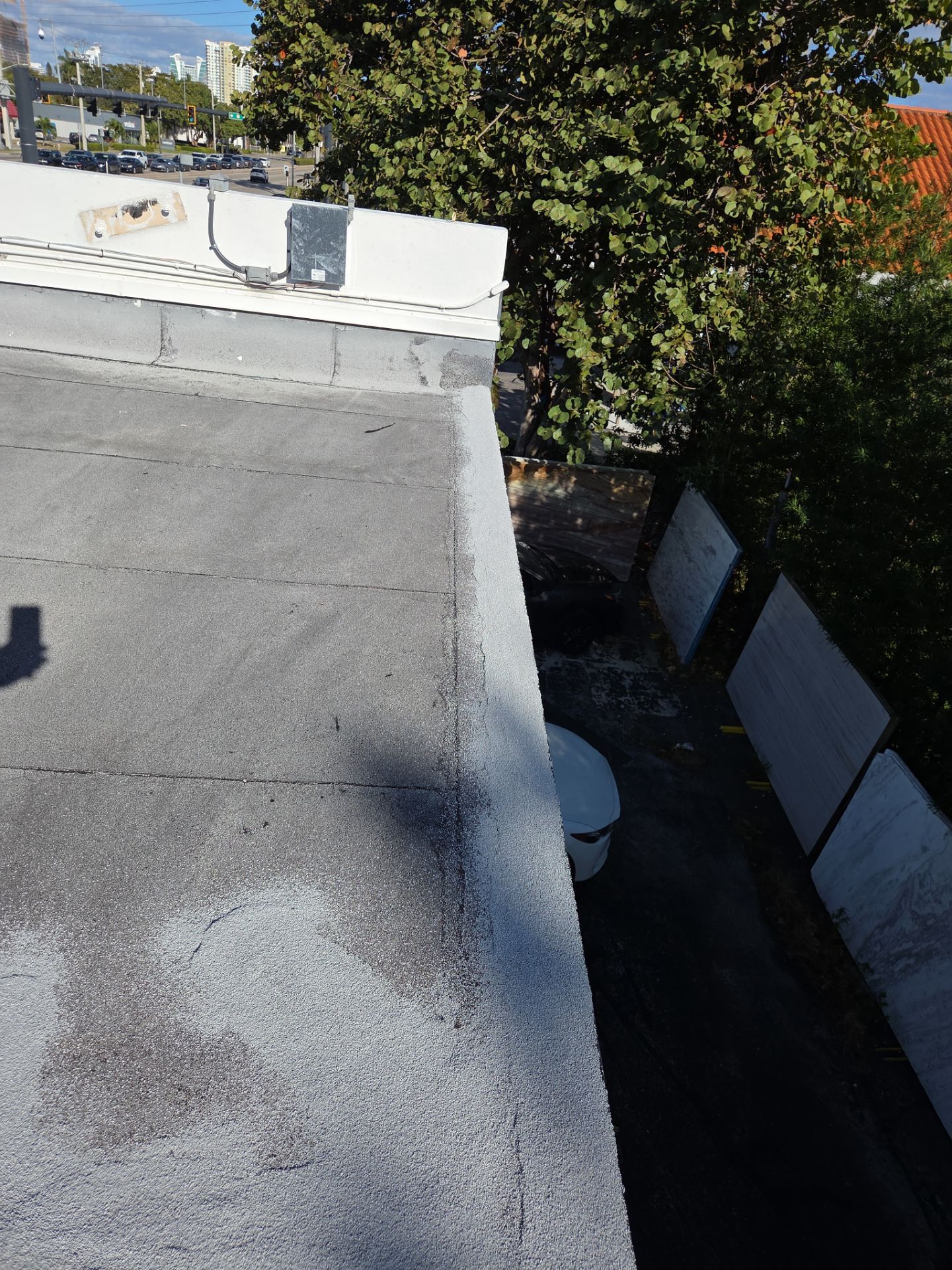 Commercial Flat Roof Restoration Using Silicone Coating in Hallandale Beach by Aastro Roofing