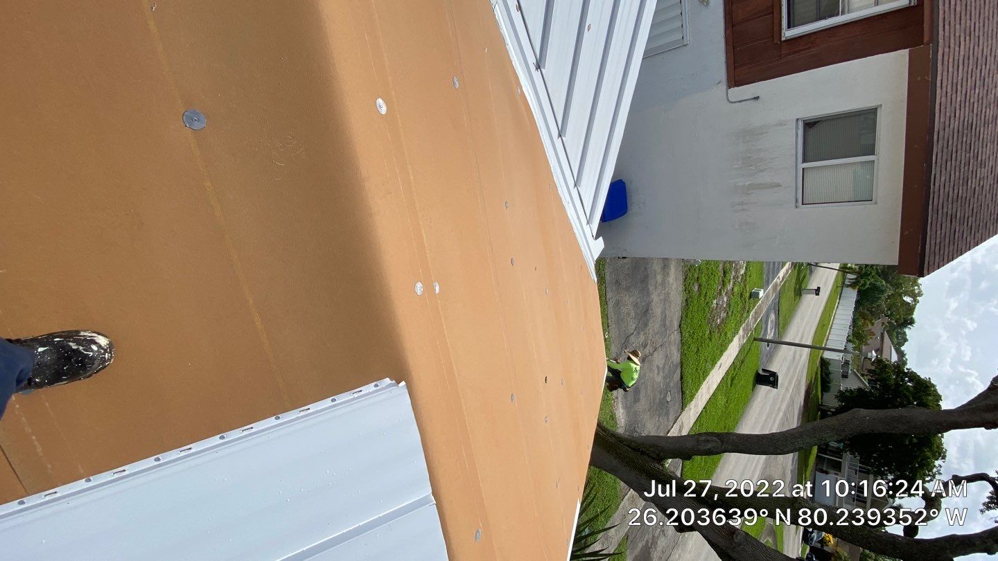 Residential Roofing Installation using 1.5" Nail Strip 24ga Solar White Kynar Coated Standing Seam Metal Panels by Morton Roofing, Inc.