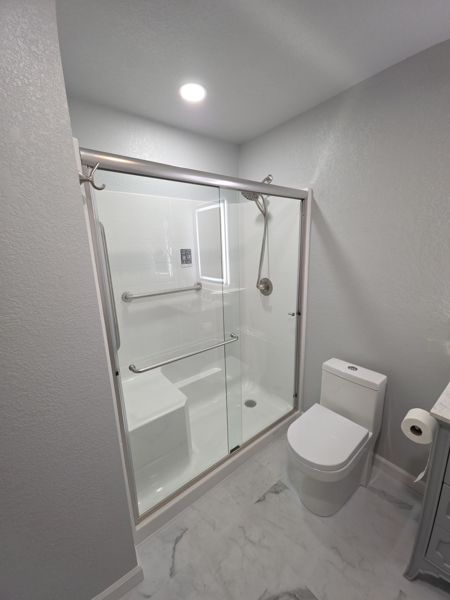 Bathroom remodel by In & Out Construction & Remodeling, LLC