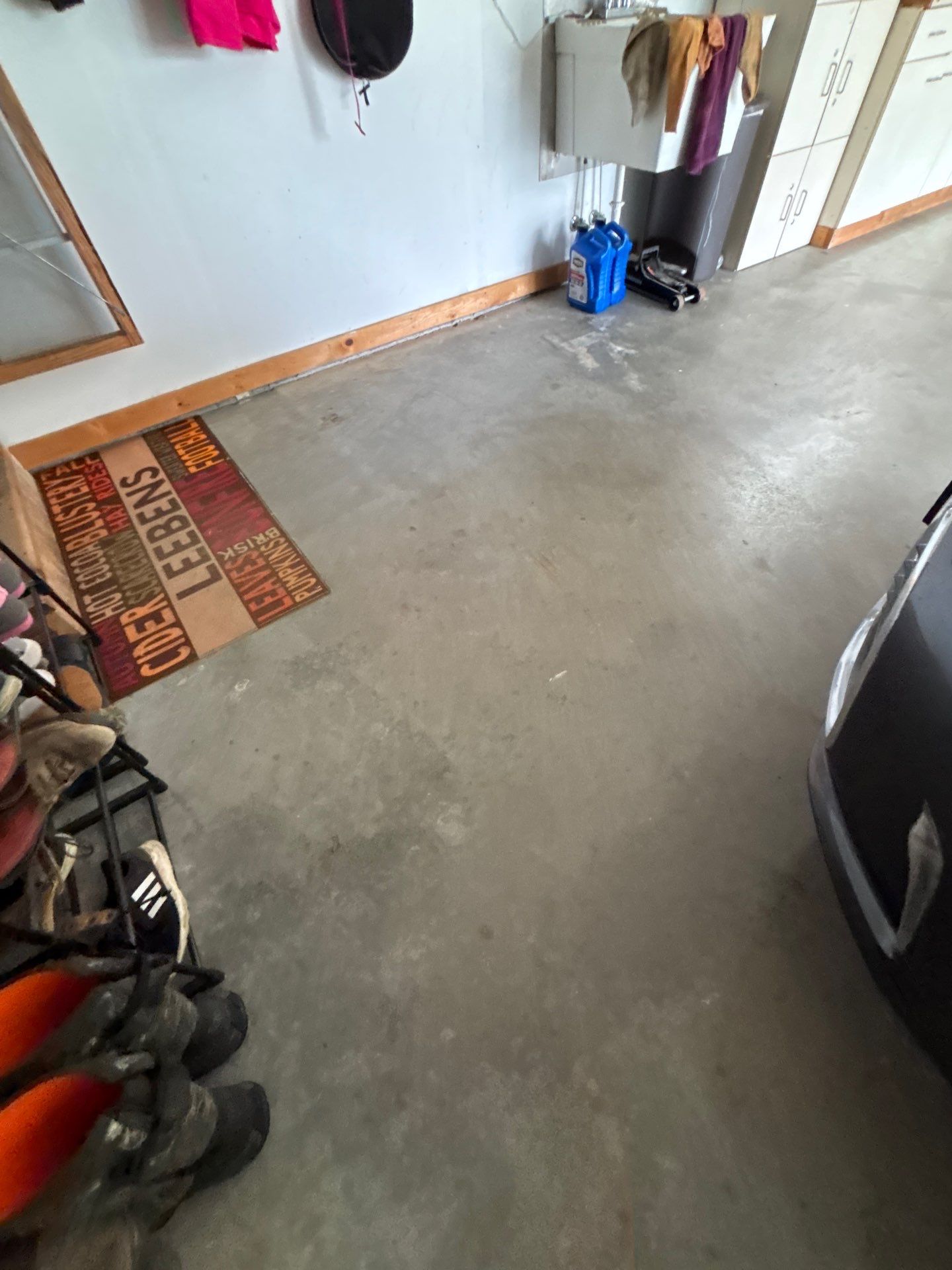 Gray and Black Speckled Polyurea Garage Floor in Dell Rapids by Select Painting, Coatings & Garage Cabinets
