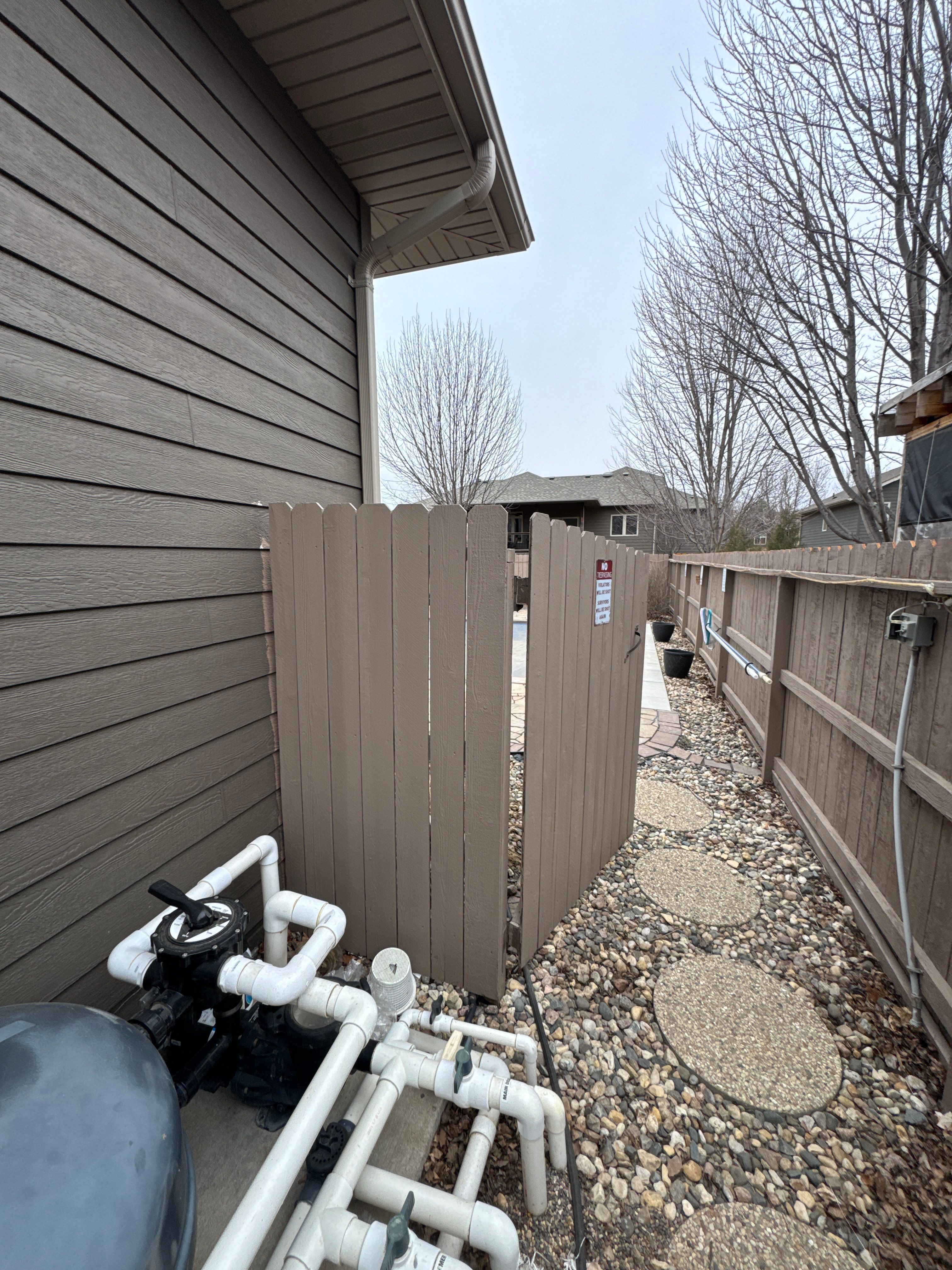 Sioux Falls Residential Exterior Update and Flagstone Pool Deck by Select Painting, Coatings & Garage Cabinets