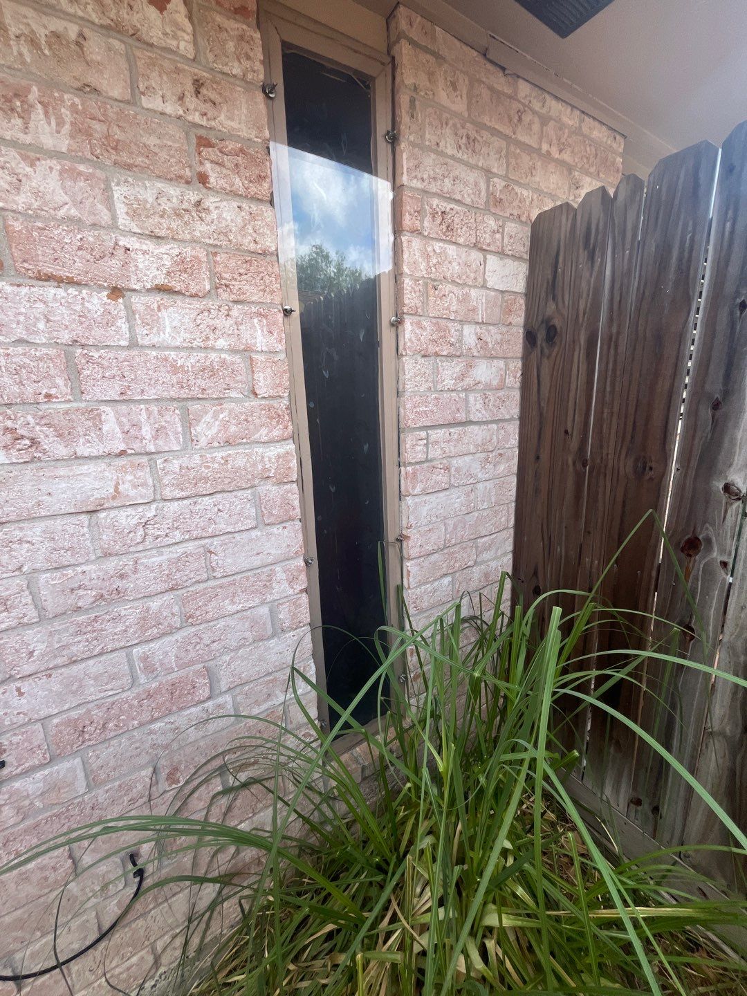 Colored Vinyl Windows to blend into brick by Bayfront Roofing and Construction
