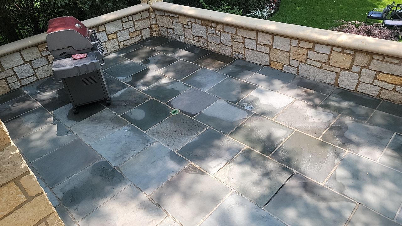 Northbrook, IL stucco home soft wash and stone cleaning by Northern Power Washing LLC.