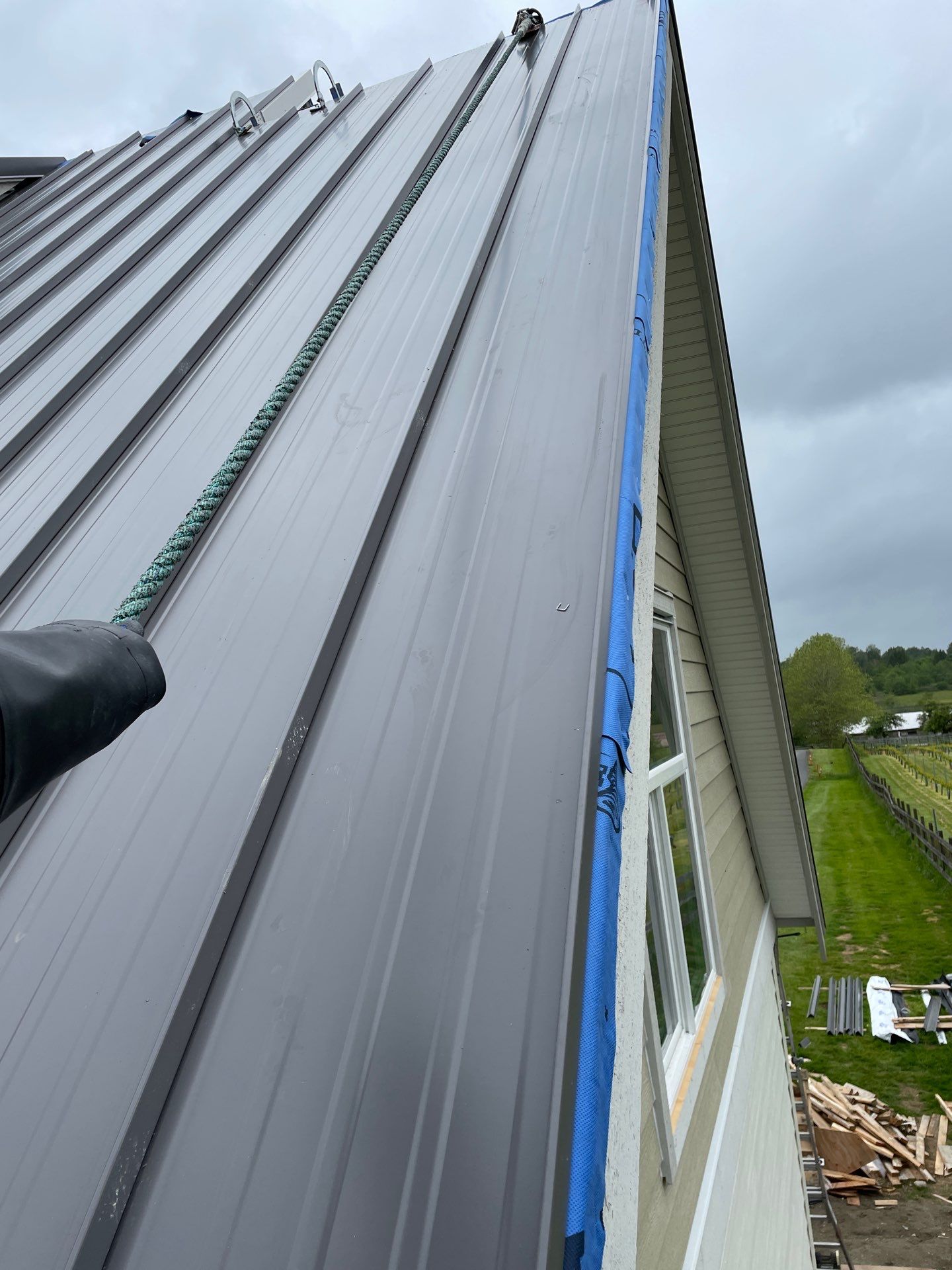 Residential Roofing Installation using 12" Prolok metal  by Top Notch Roofing Inc