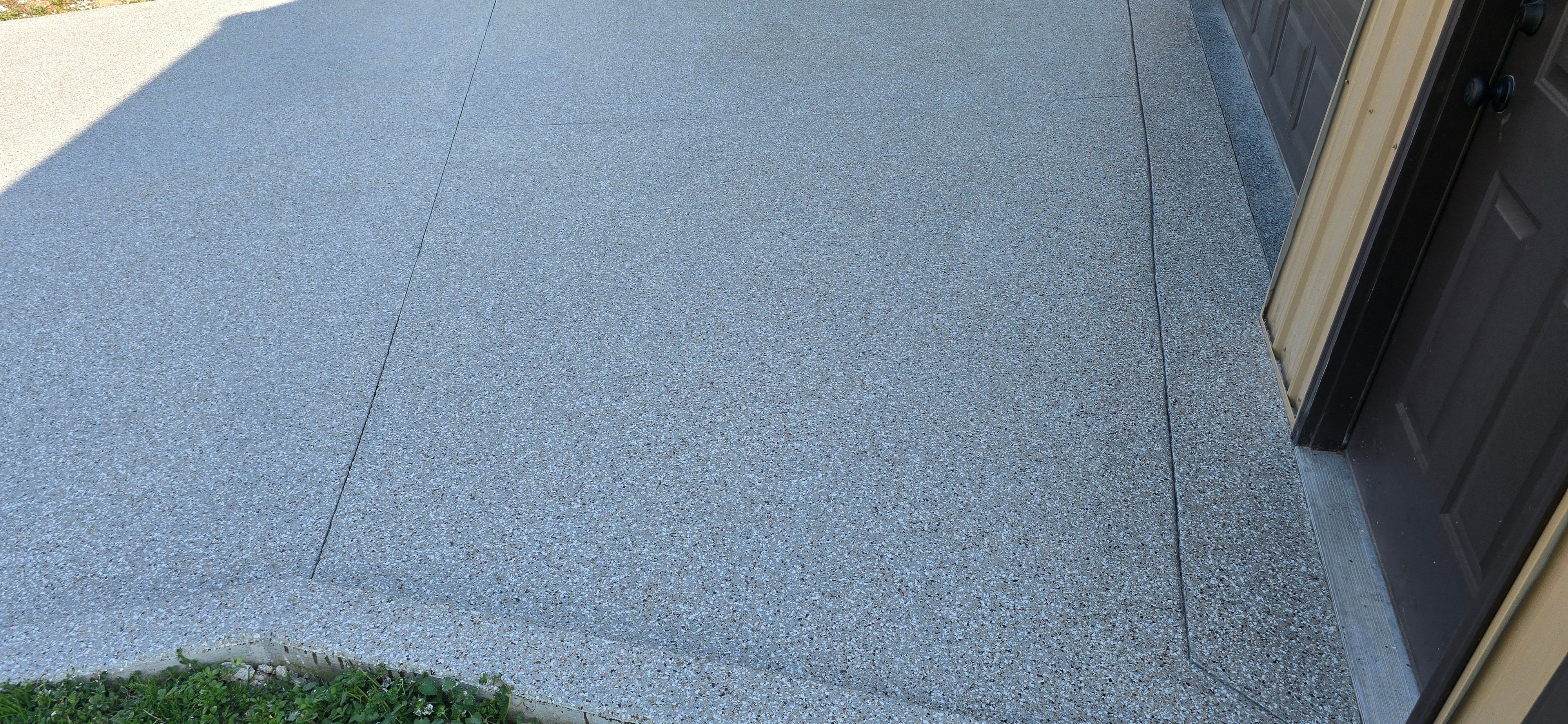 Driveway using Creekbed by Elite Floor Solutions