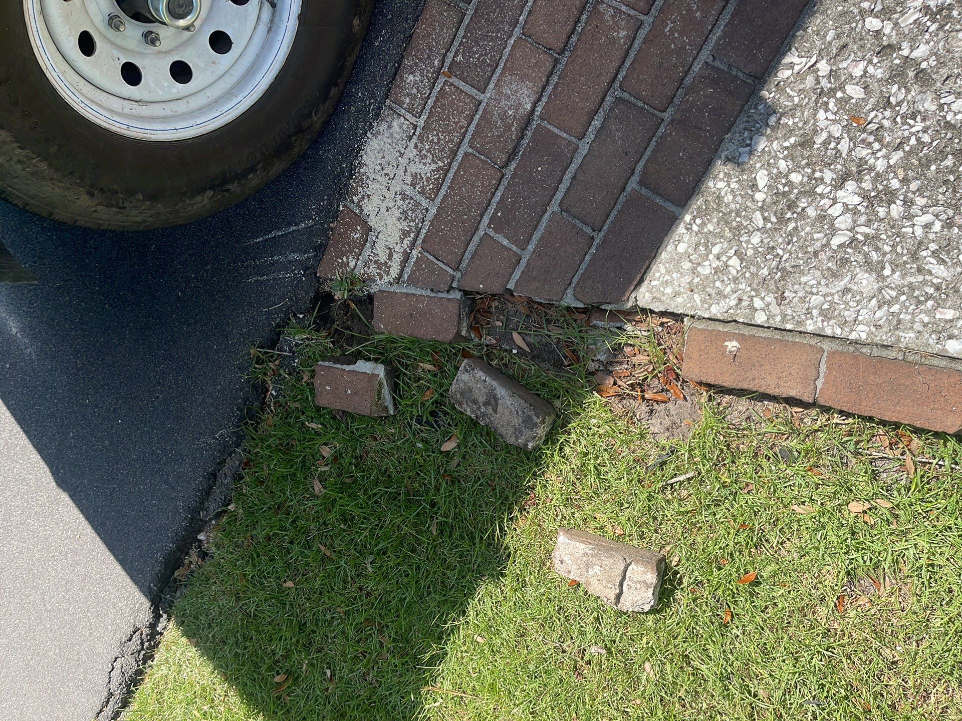 Custom Exposed Aggregate Driveway with Red Brick Borders in Hilton Head Island by Lowcountry Scapes, LLC
