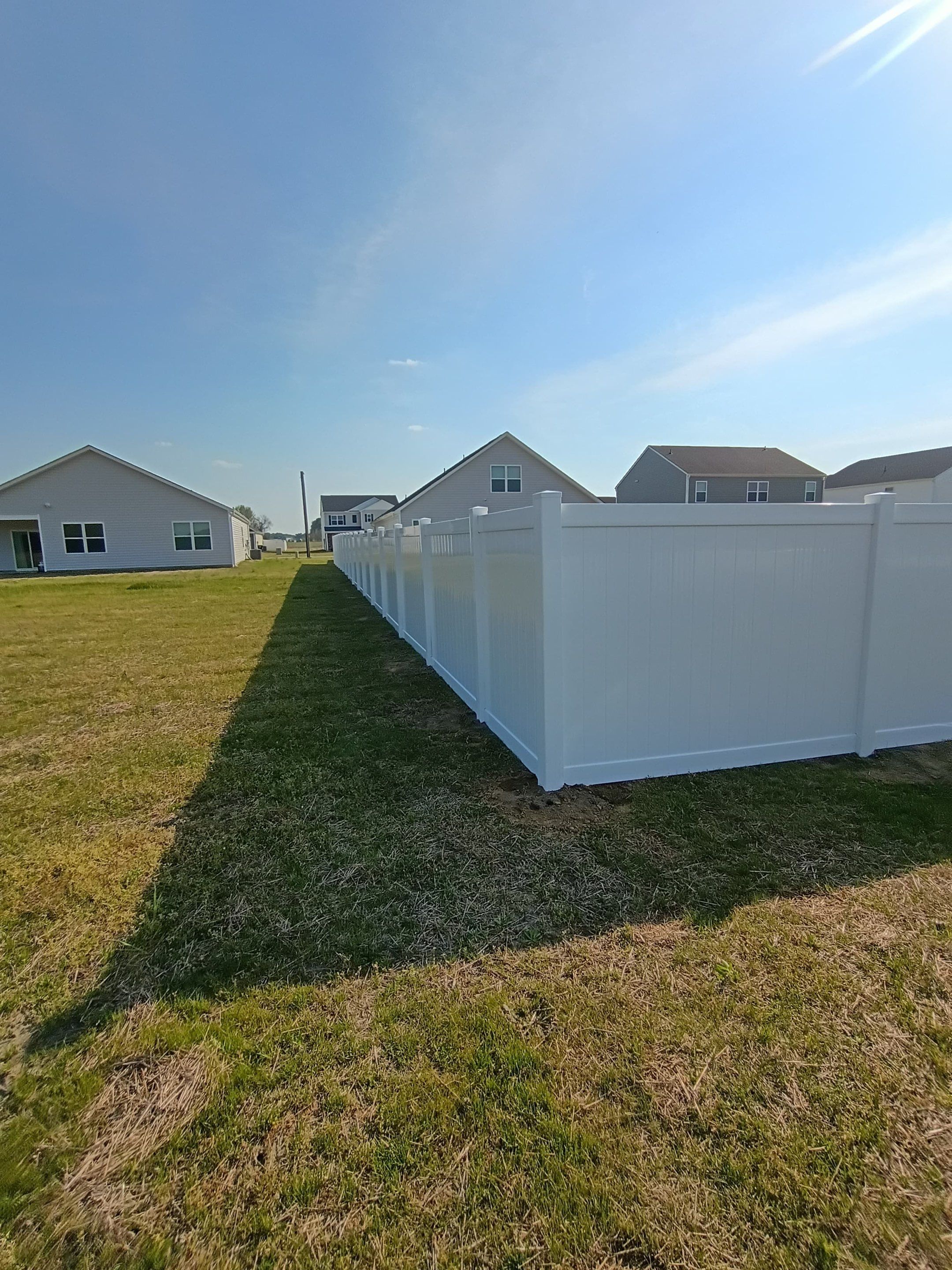 White Vinyl Privacy Fence Installation in Ayden, North Carolina by Superior Fence and Rail