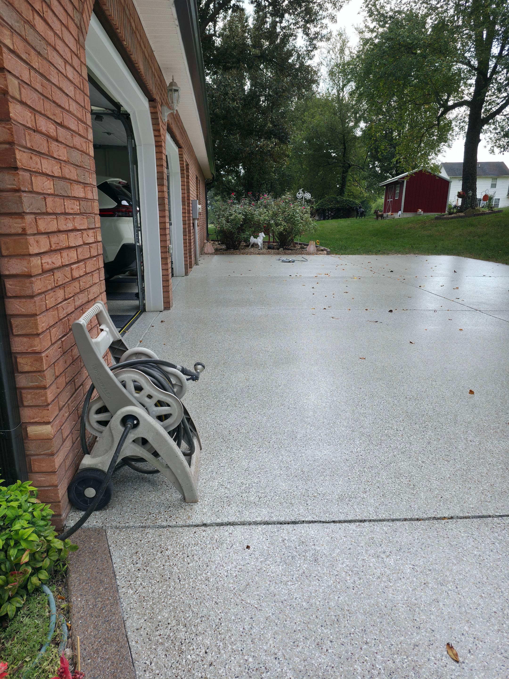 Driveway Using Creekbed and Garnet by Elite Floor Solutions