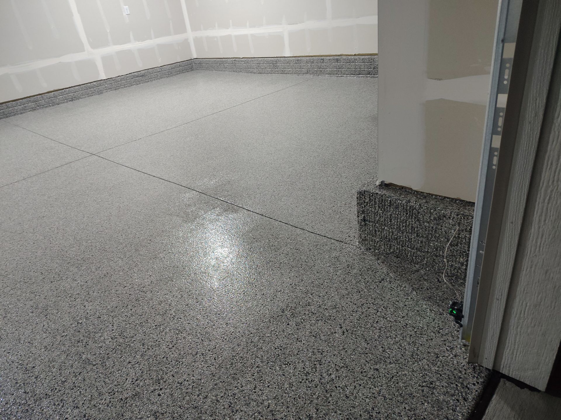 Adel, IA Garage: Complete Keystone Wrap on Floors, Stairs, and Stem Walls by Revival Concrete Coatings