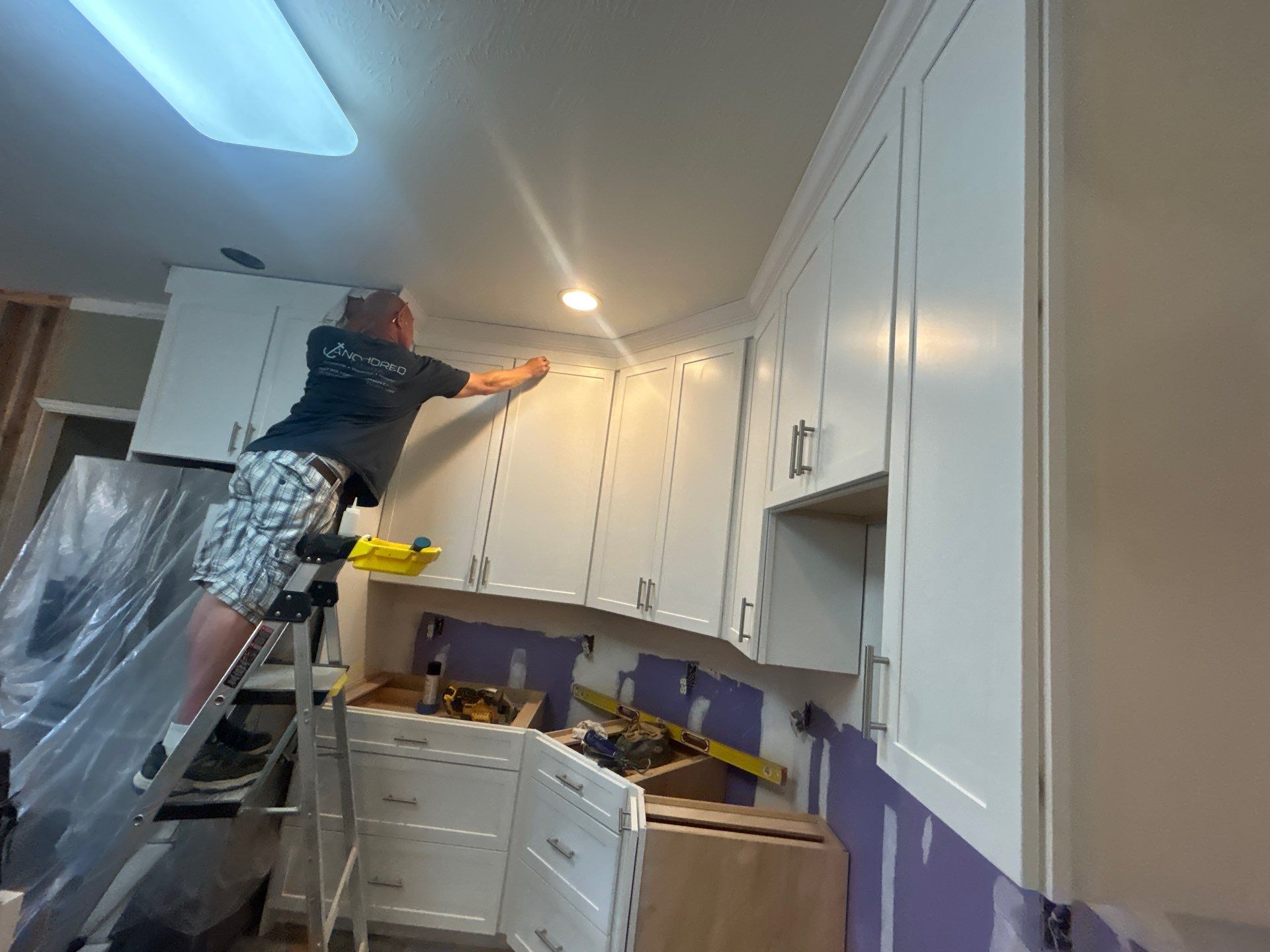 Complete Kitchen Renovation Featuring White Shaker Cabinetry in Fayetteville by Karcher Roofing & Construction