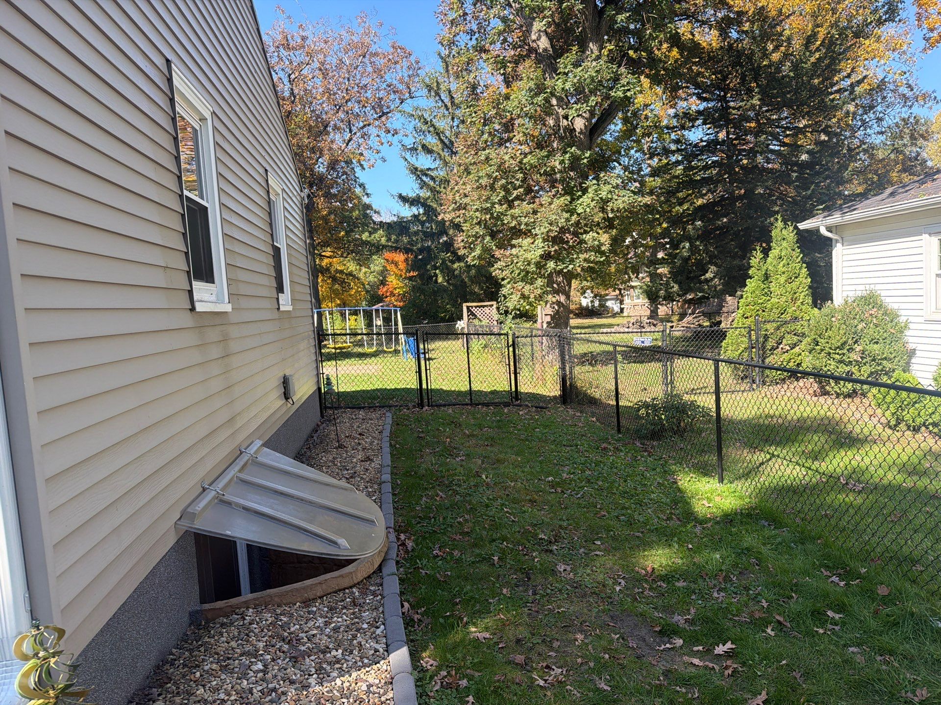 Residential Black Chain Link Fencing in Cedar Falls by Perfect Picket Fence and Stain