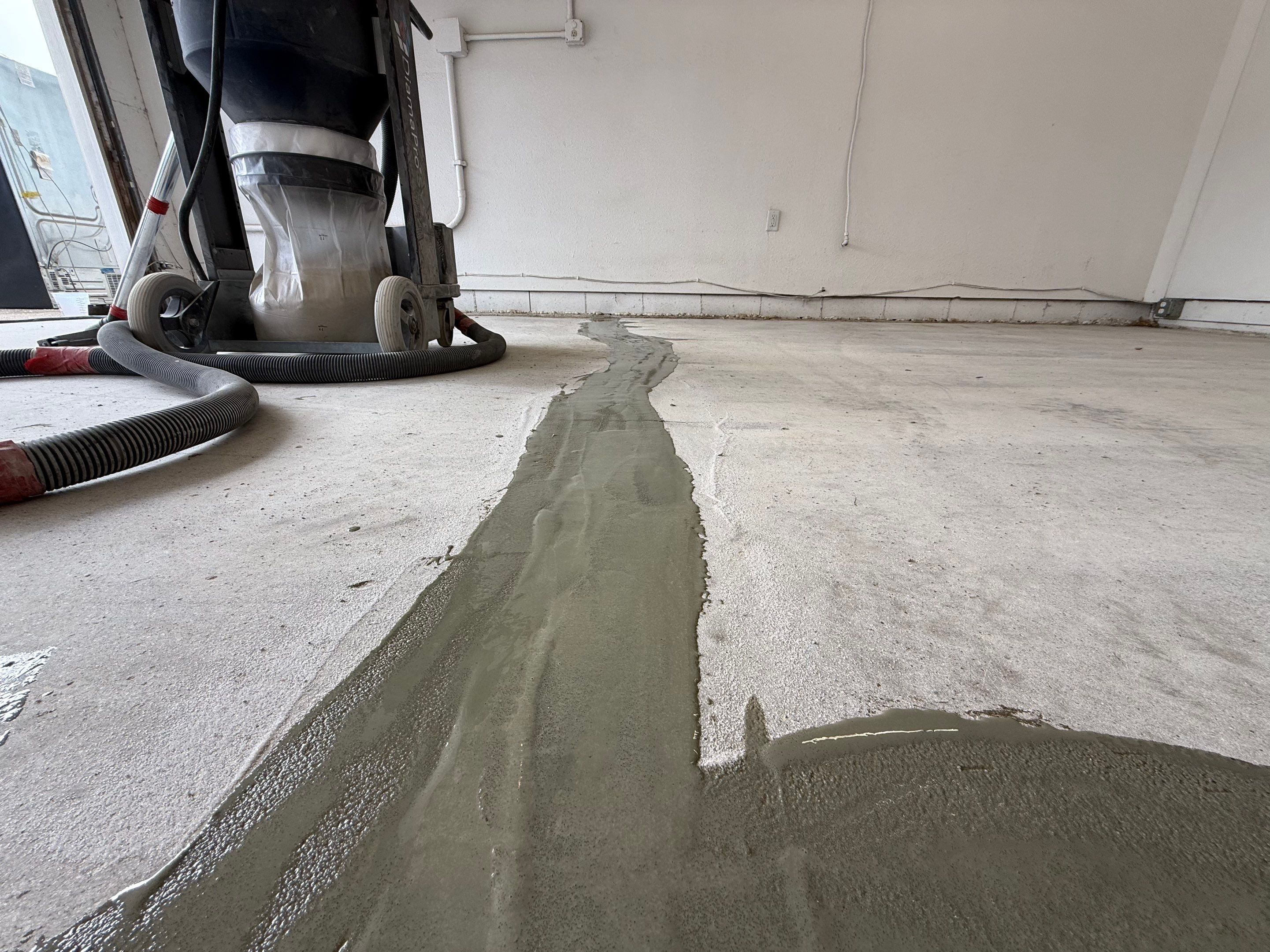 Feather Grey Garage Floor Coating and Crack Repair in Beresford by Select Painting, Coatings & Garage Cabinets