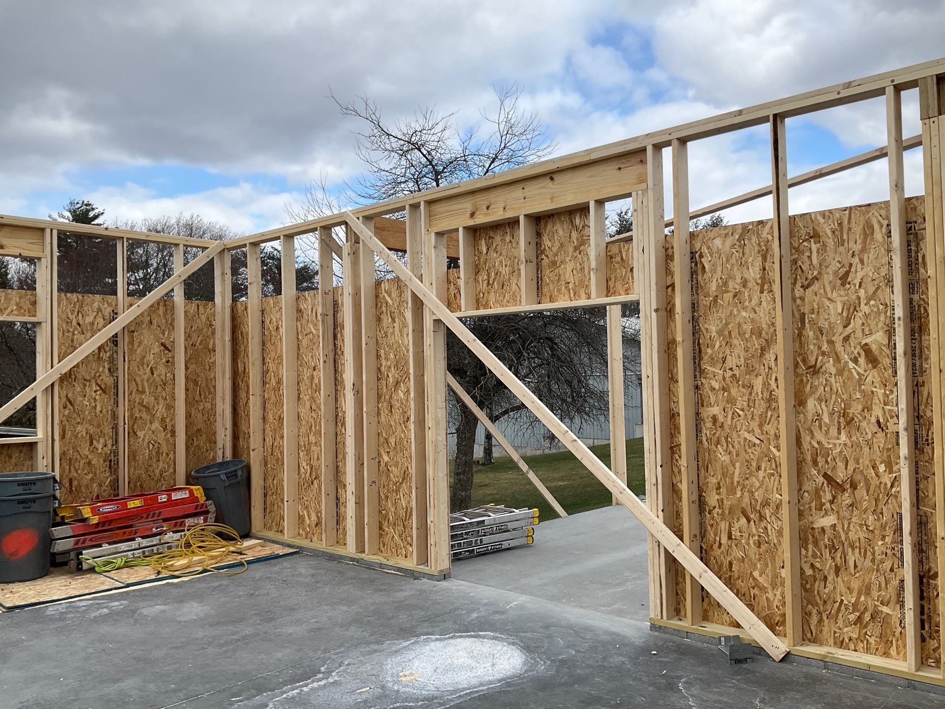 Tower City Residential Addition Featuring Gray Vinyl Siding and Garage by Esh Builders