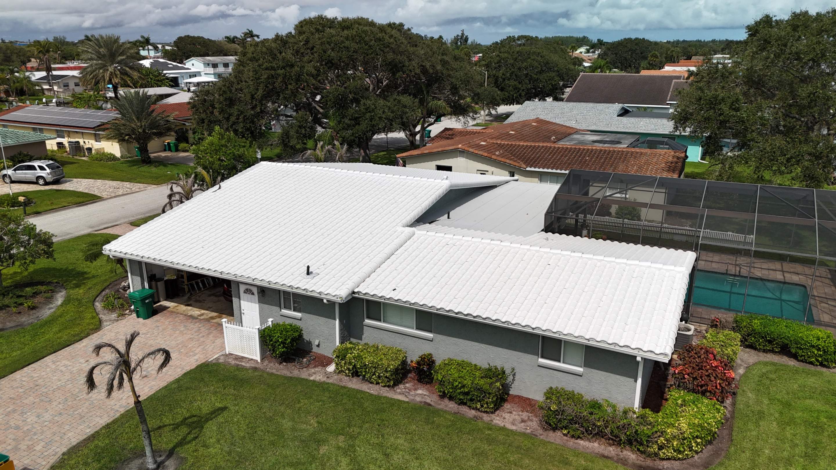 Comprehensive Concrete Tile and Flat Membrane Roof Replacement in Cocoa Beach by Wiedmann Construction & Roofing
