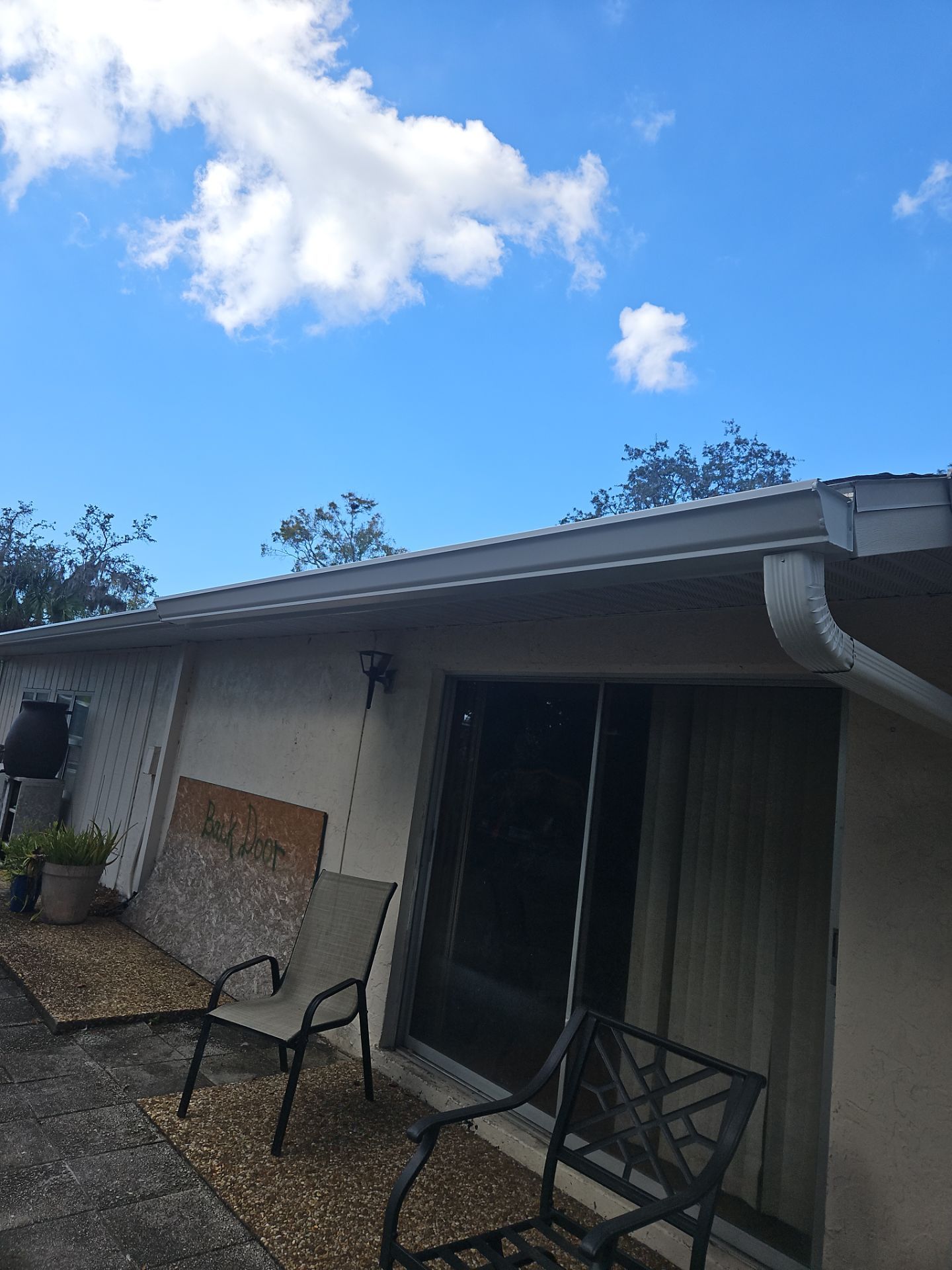 Downspout Installation using White Down Spouts in Sarasota FL by Gutter Professors