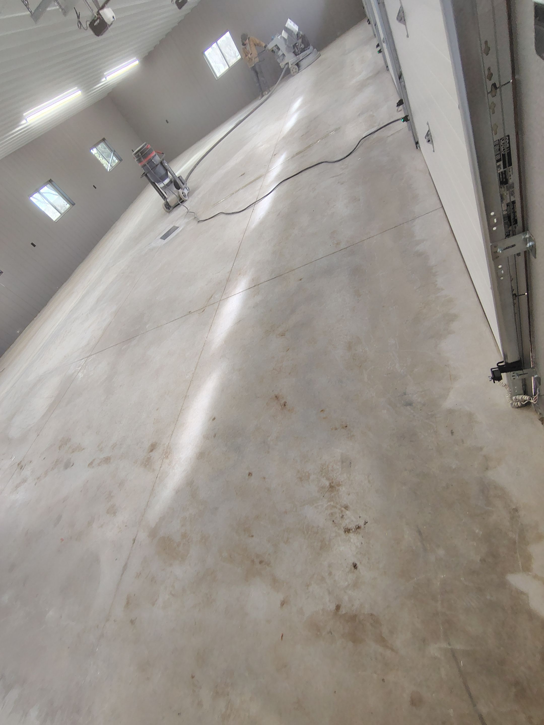 Speckled Epoxy Floor Coating for Large Shop in Rock Valley by Select Painting, Coatings & Garage Cabinets