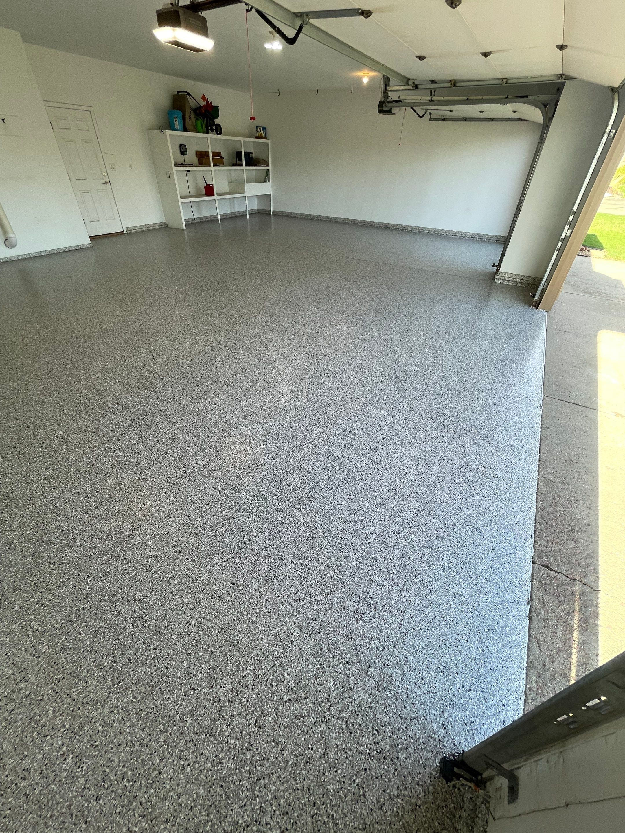 Yankton Garage Floor Restoration with Gray Speckled Epoxy Coating by Select Painting, Coatings & Garage Cabinets