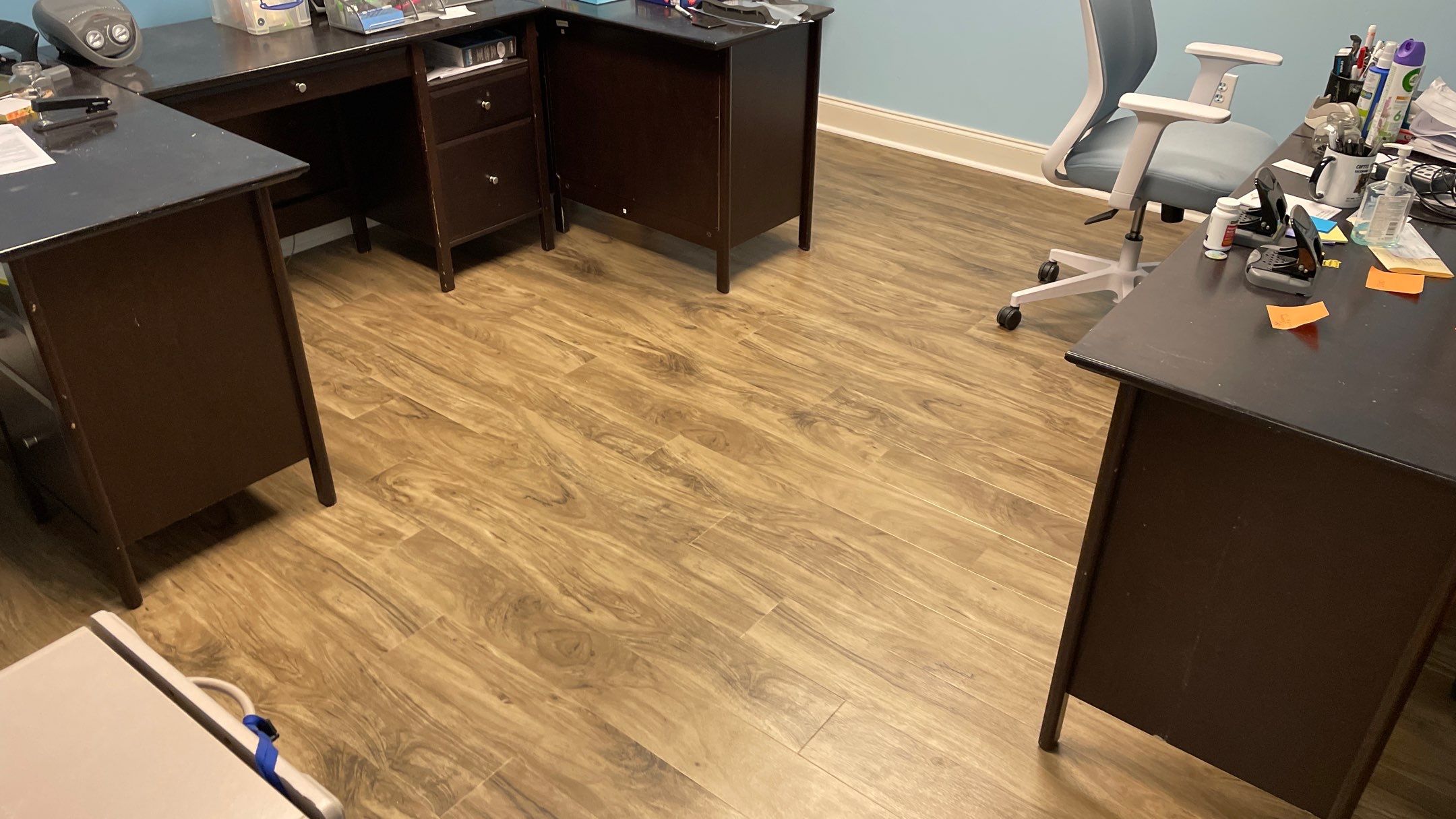 Office Remodel from Worn Out Carpet to Sleek Glued Down LVP by Footprints Floors of Coastal Carolina