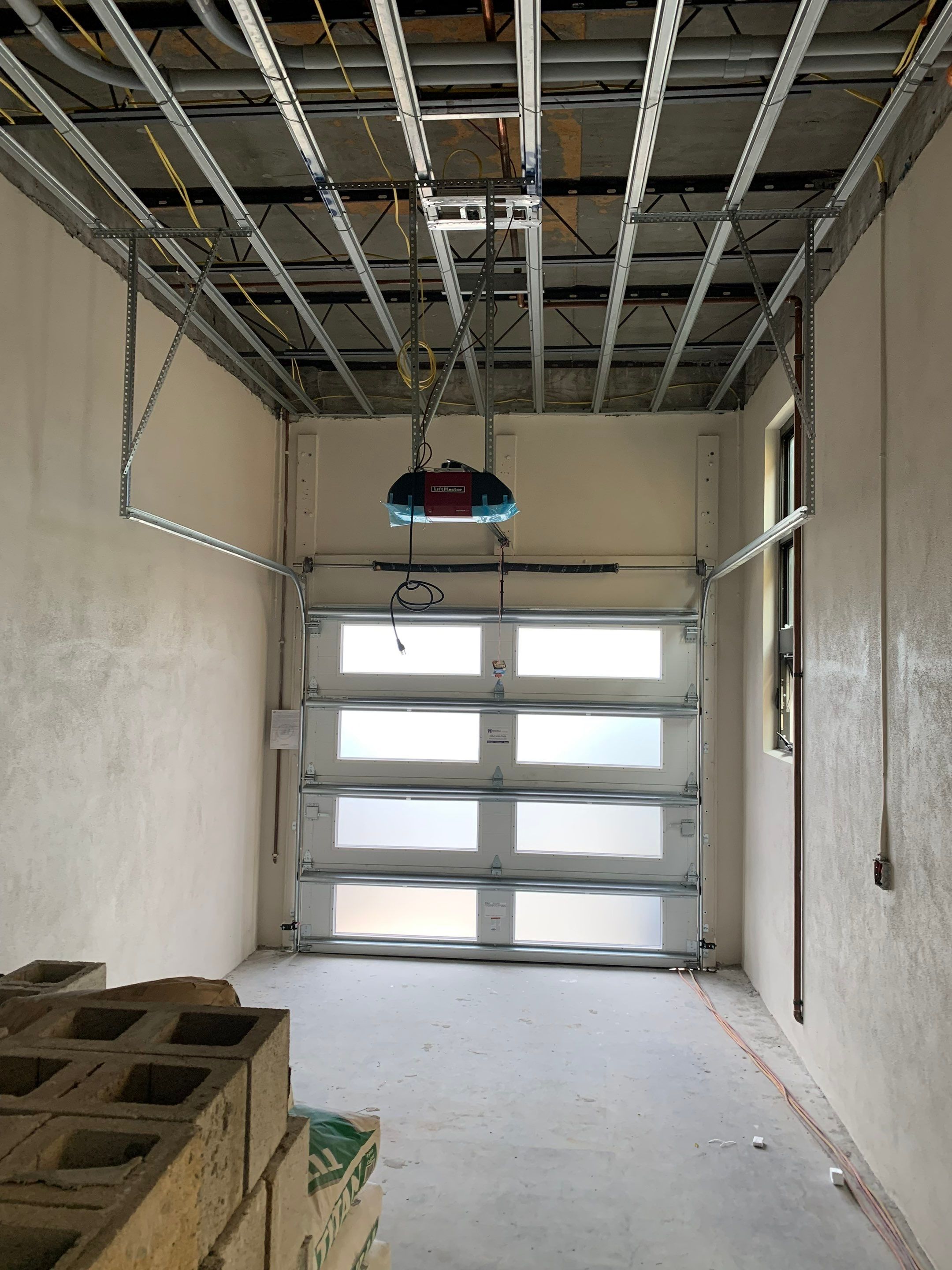 Modern Garage Door Installation for New Construction – Las Olas Isles, Fort Lauderdale, FL by The Door Doctor of South Florida, Inc.