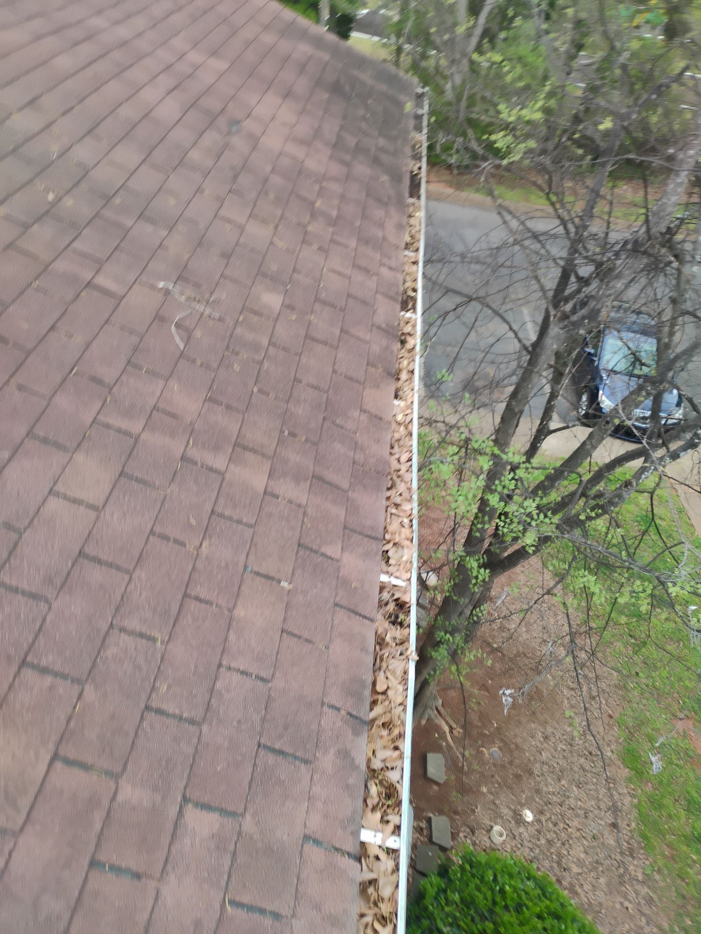 Commercial gutter cleaning Athens, GA before photo with filled gutters