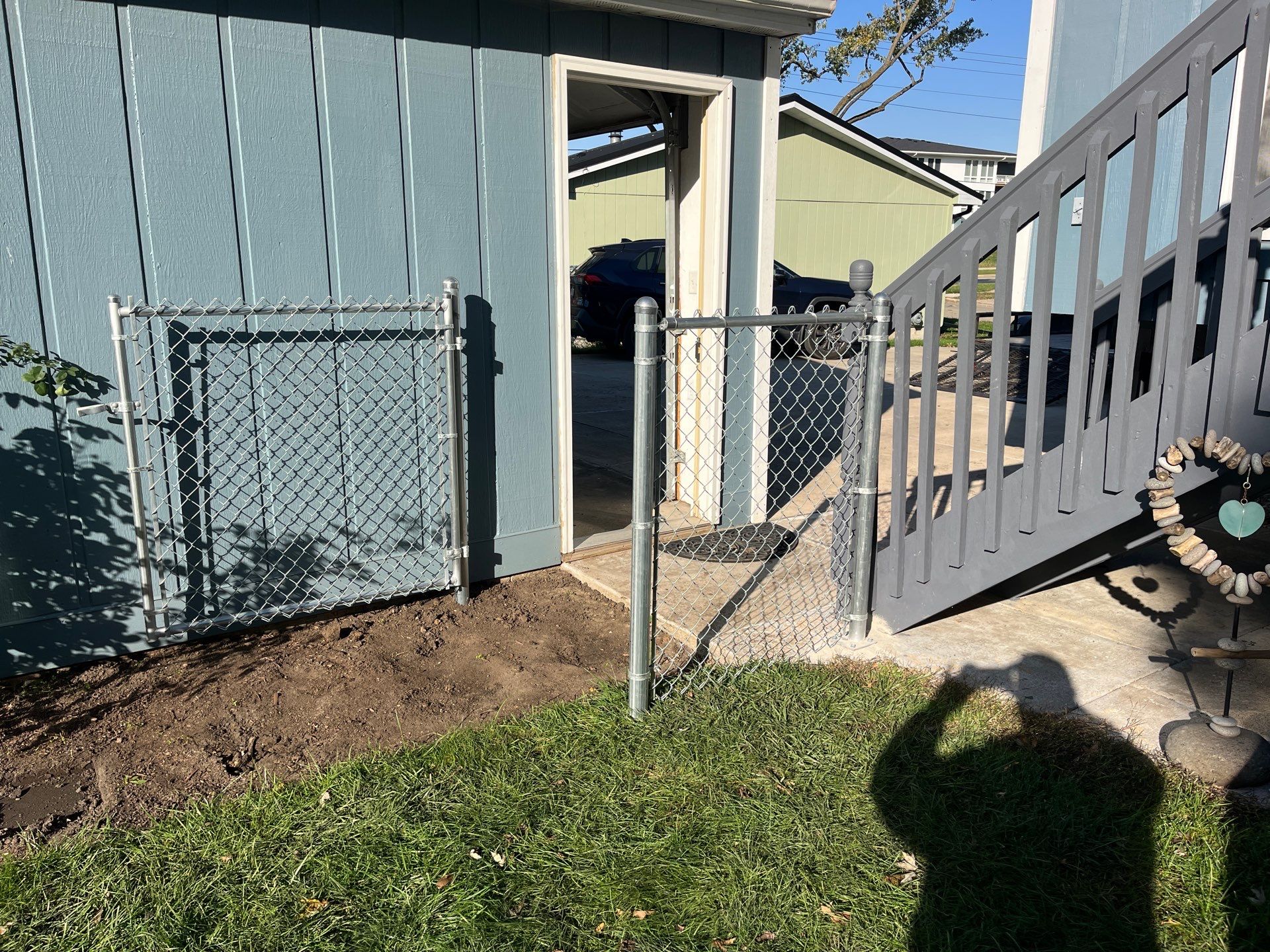 Chai Gray Vinyl Privacy Fence and Gate Installation in Cedar Falls by Perfect Picket Fence and Stain