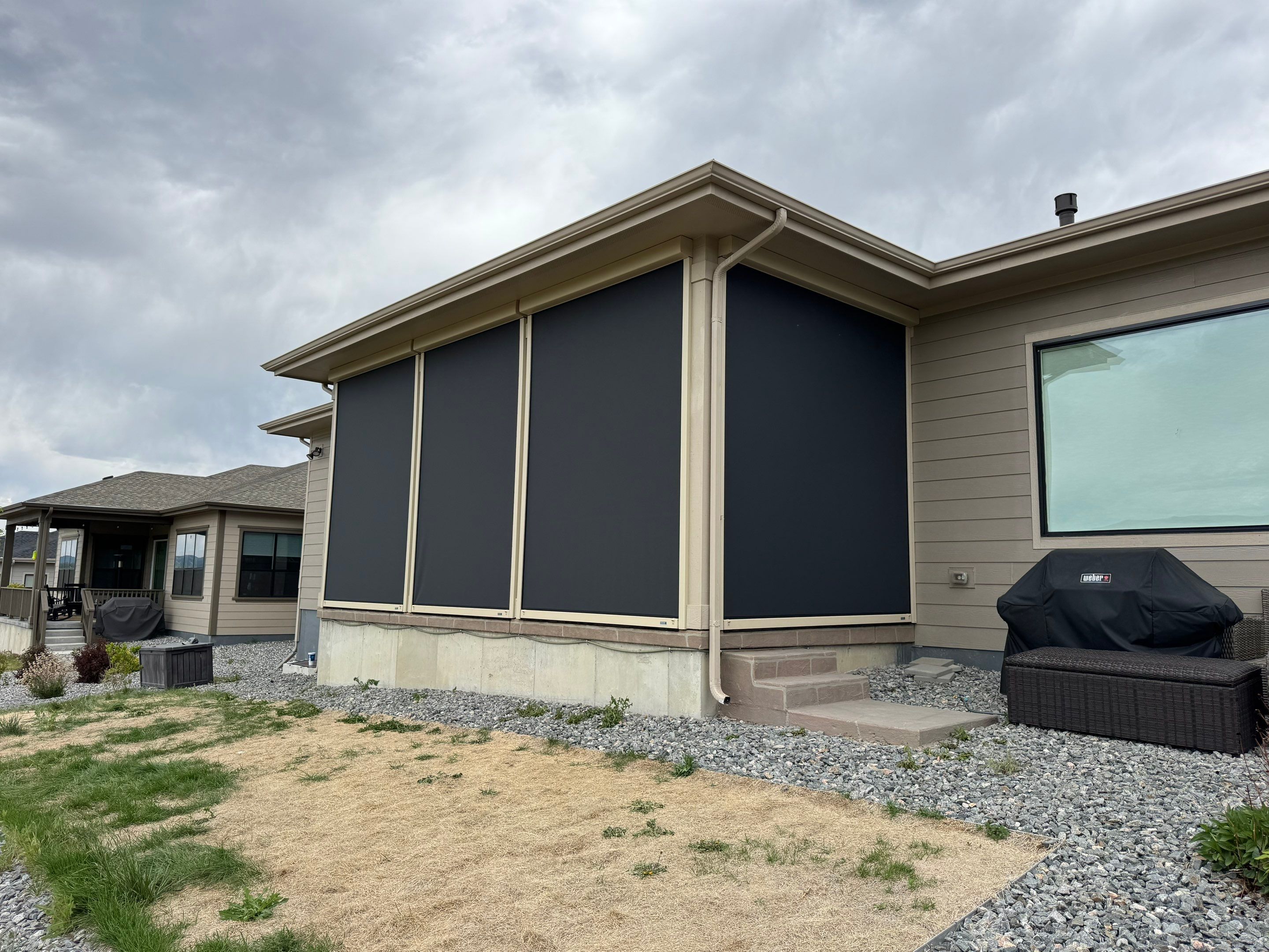 Exterior MagnaTrack Solar Screen Installation on Castle Rock Covered Patio by Outdoor Solutions Colorado