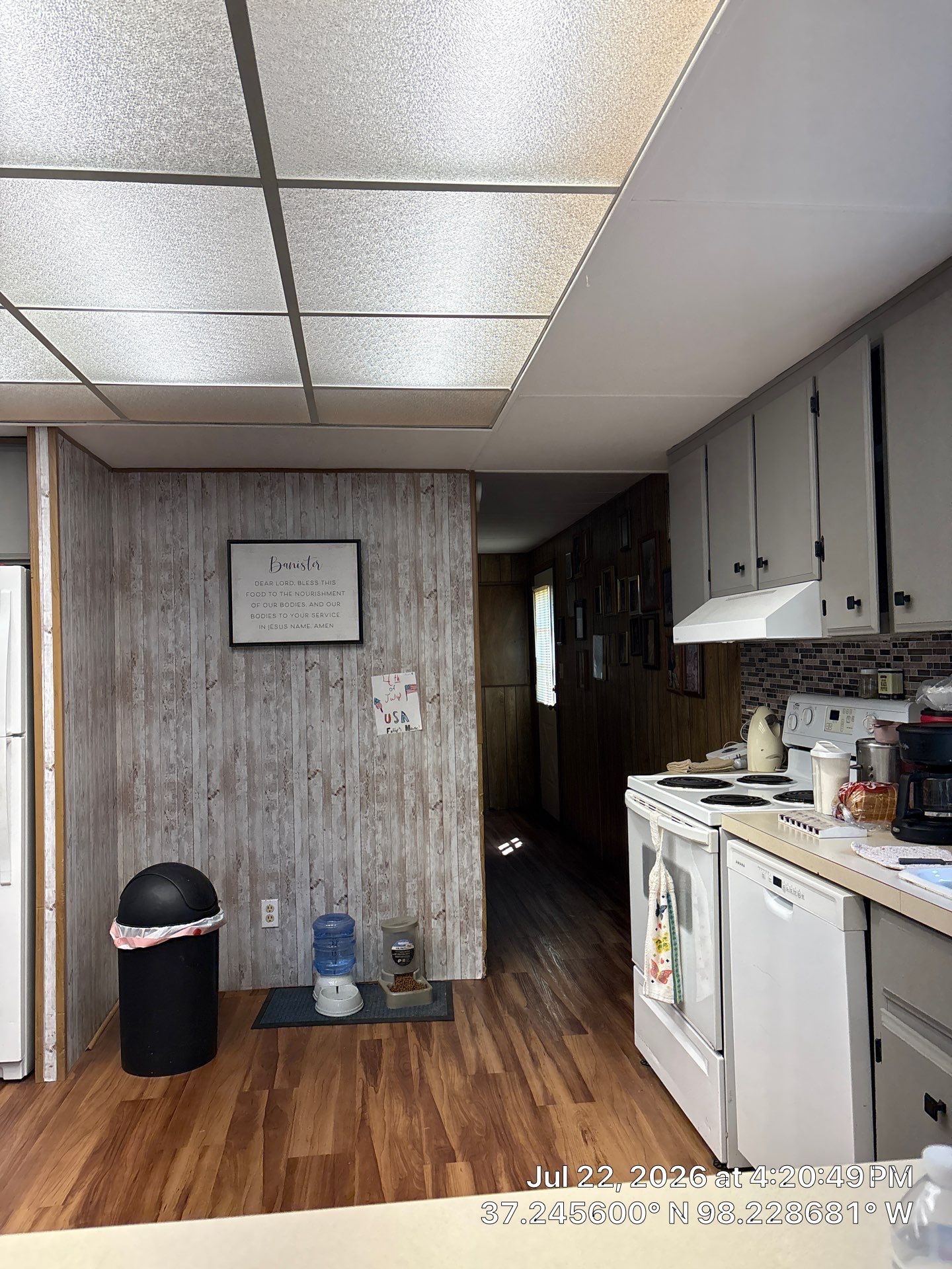 Kitchen Renovation Featuring Grey Cabinetry and Laminate Flooring in Attica by CompanyCam Sales Demo