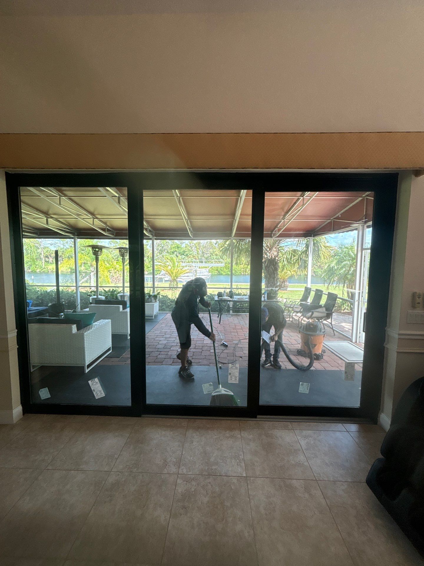 PGT Black pocket doors and Euro-Wall storefront & SGD by Windows For Life 