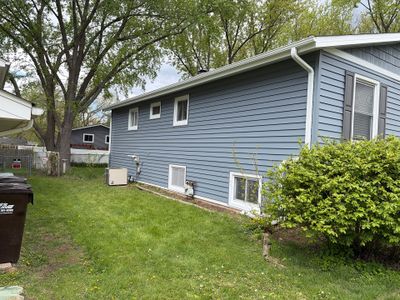 Premium vinyl siding install close-up in Crystal Lake
