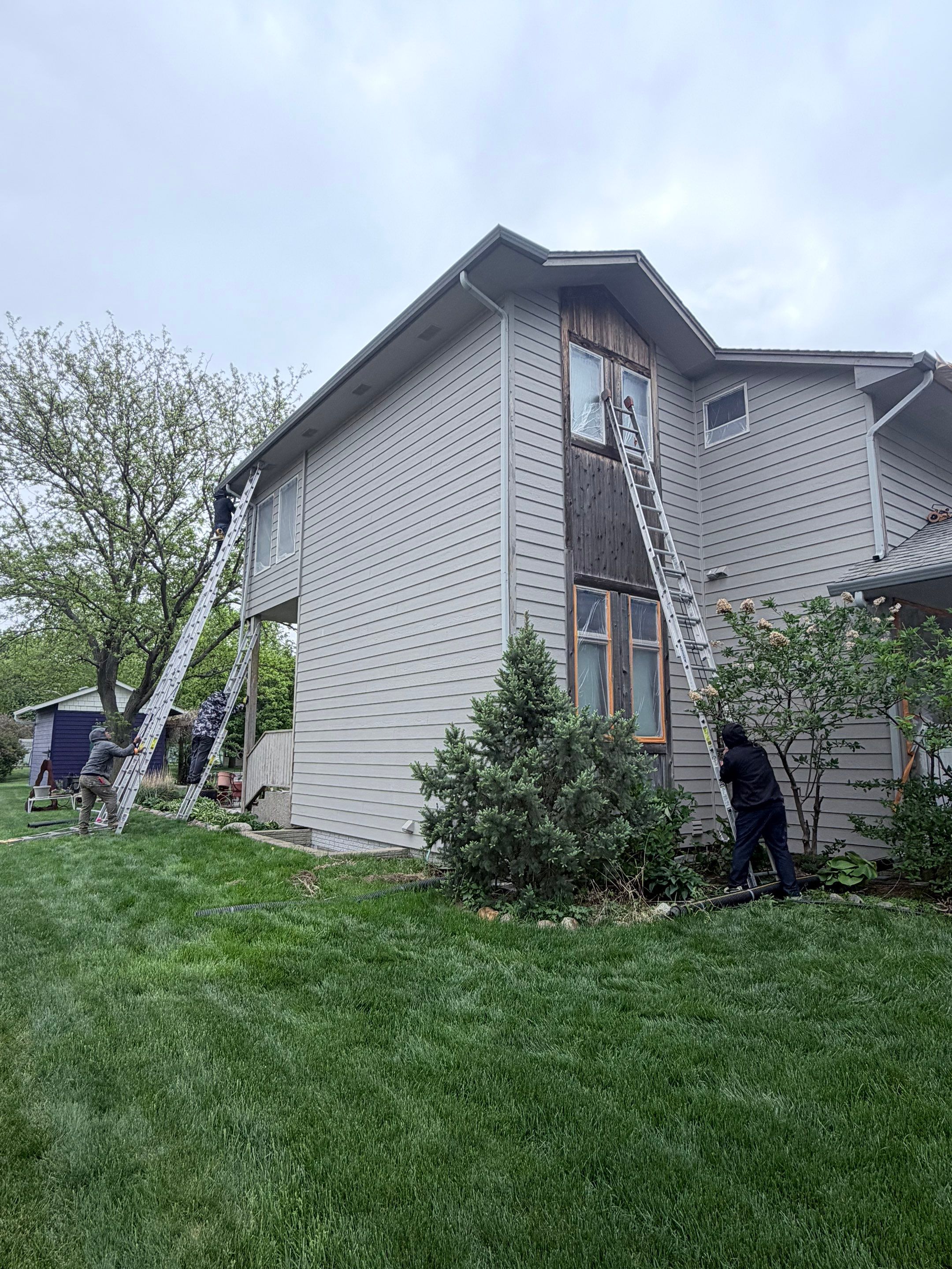 Exterior Siding and Trim Painting for Sioux Falls Residence by Select Painting, Coatings & Garage Cabinets
