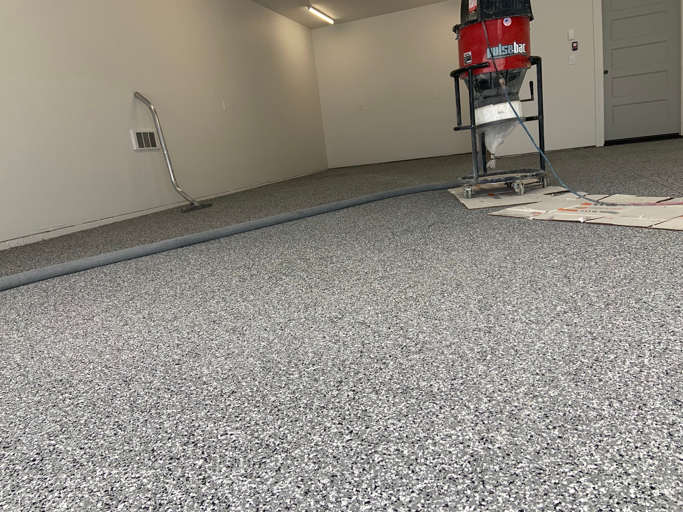 Garage Transformation using Smoke by Croc Coatings, LLC