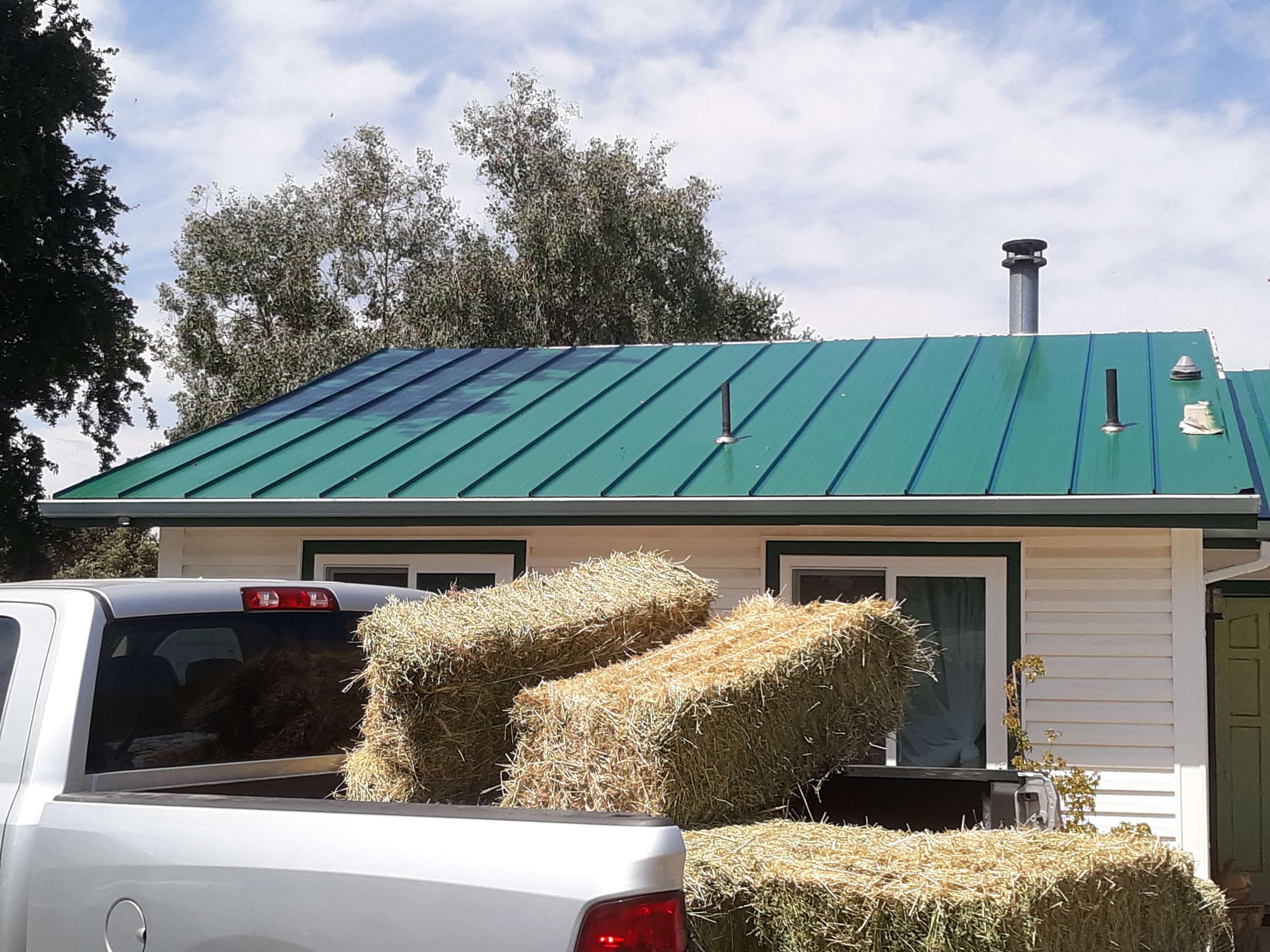 Metal roofing installation using Standing seam metal roofing system by Straight Edge Roofing Inc